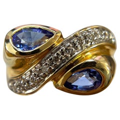 Swirling Beauty: 14K Yellow Gold Pear-Shaped Tanzanite and Diamond Ring