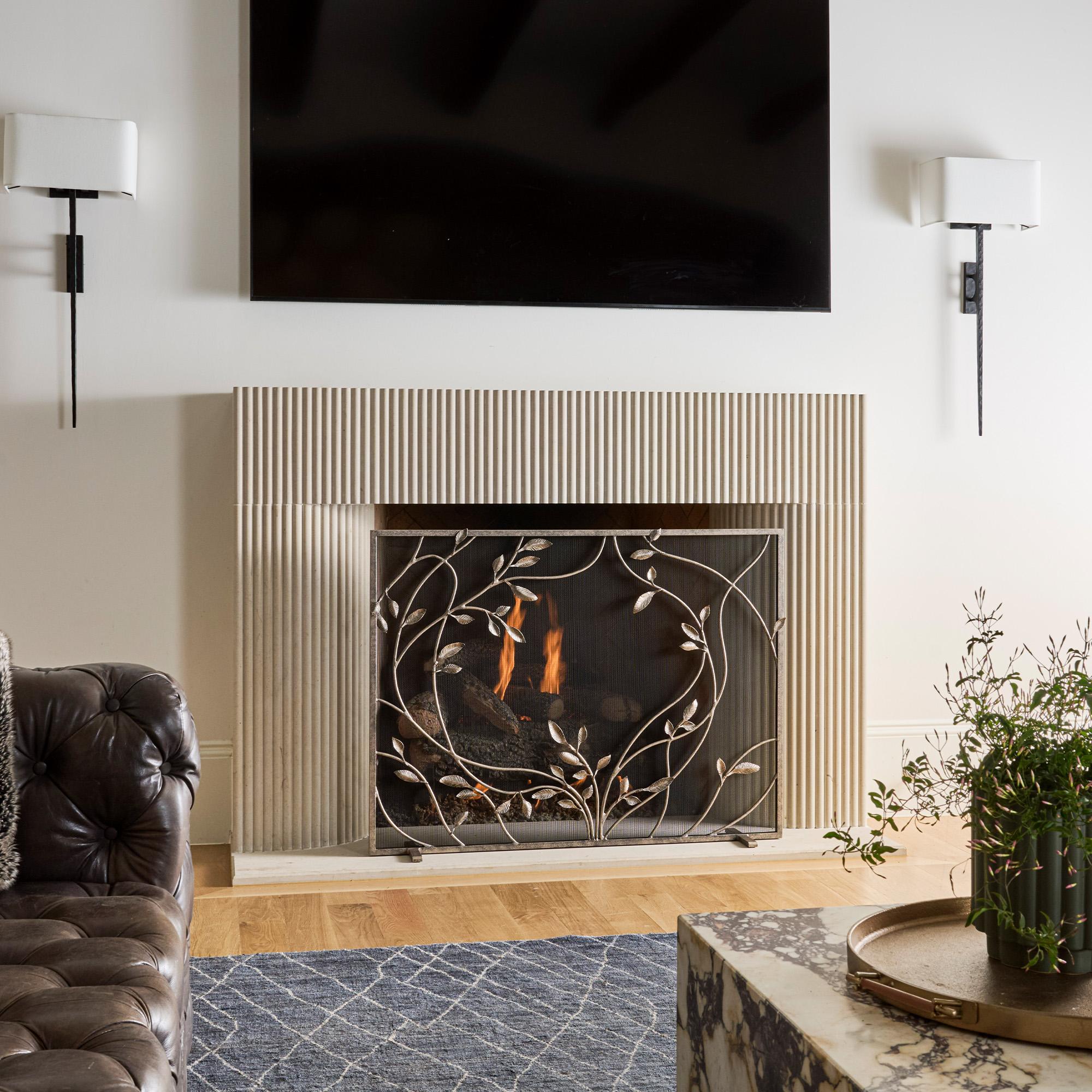Curving vines flow across the screen like wind through leaves, capturing a sense of natural rhythm and quiet elegance. The Swirling Jasmine Vines Fireplace Screen brings a poetic fluidity to the hearth, with each tendril and leaf sculpted in