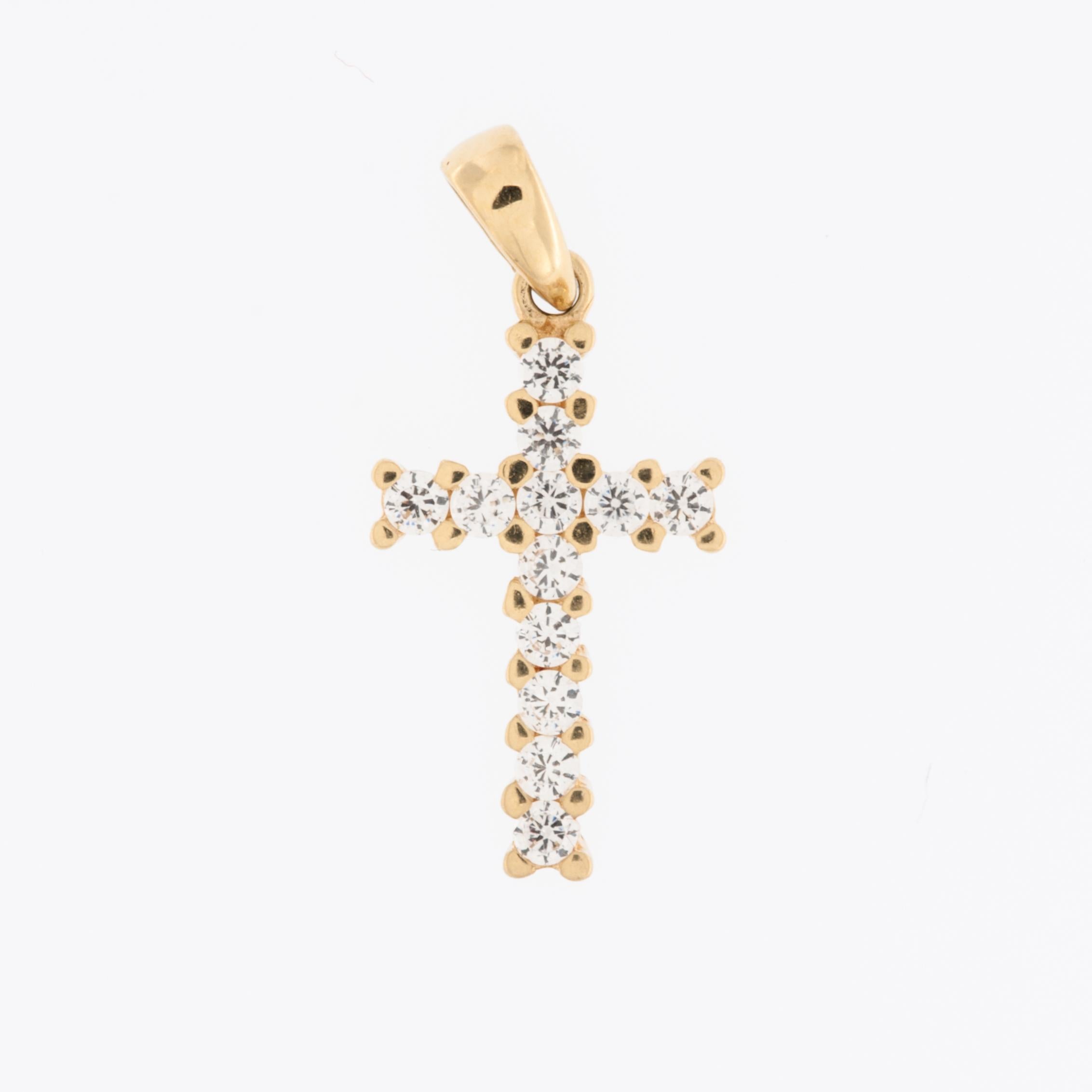 The Swiss 18kt Yellow Gold Cross with Diamonds in claw setting is a luxurious and elegant piece of jewelry. 

The cross is crafted from 18kt yellow gold, known for its rich and warm hue. This high-quality gold is prized for its durability and