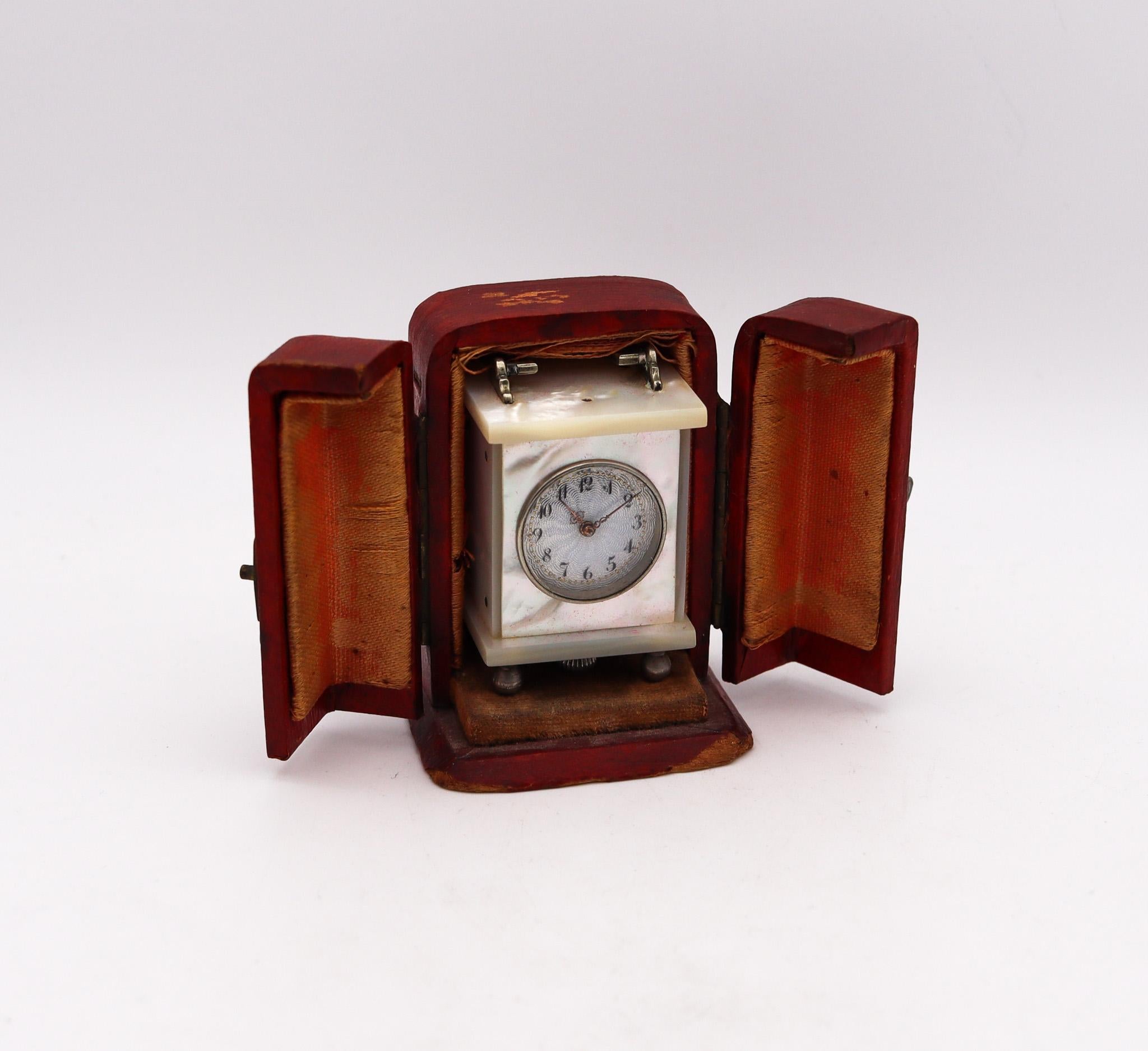 A miniature travel clock designed by Valmé.

Beautiful miniature travel-carriage clock, made in Geneva Switzerland. This rare little antique clock has been created during the art deco period, back in the 1920. It was crafted with gorgeous details