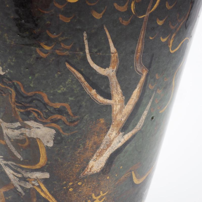A stunning late 1930s hand painted art pottery vase of the goddess Diana hunting by Atelier Menelika, Geneva. Painted in the prevailing modern style for Atelier Manelika by Helene Amoudruz with Charles Imbert. Deep green luster pedestal vase with