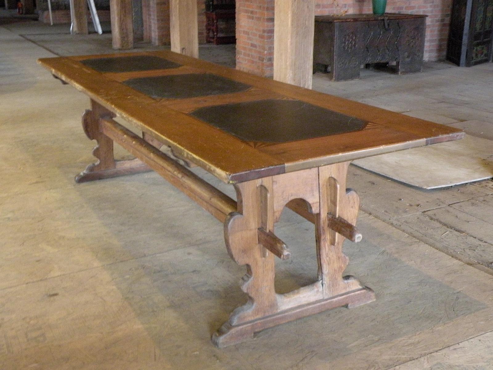 Alpine, most likely Swiss 18th century rustic, long pine and slate inset dining or kitchen trestle table
of rare form and rustic appearance, beautiful light color of the pine contrasting with the three black slate slabs set into the long top within