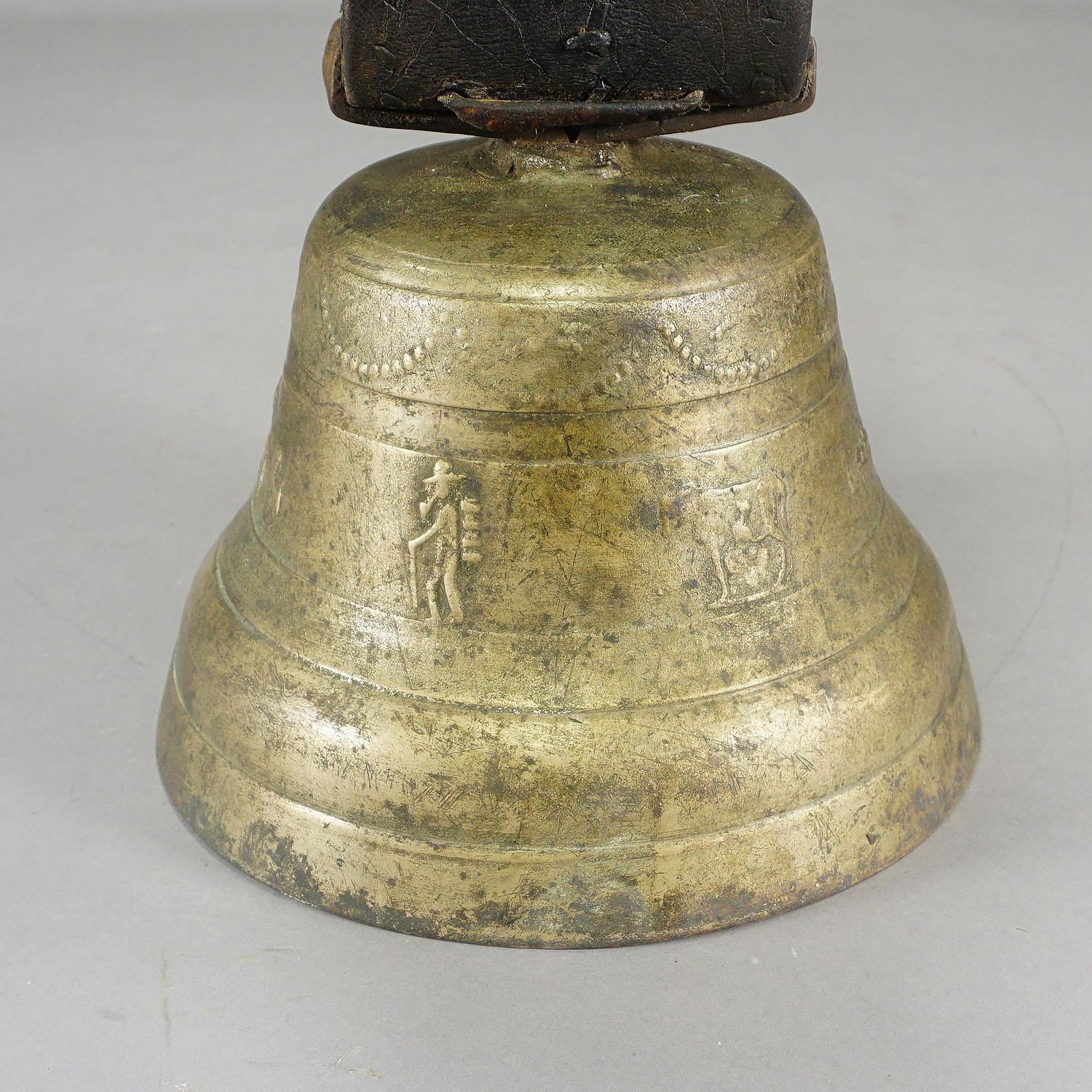 antique cow bell with leather strap