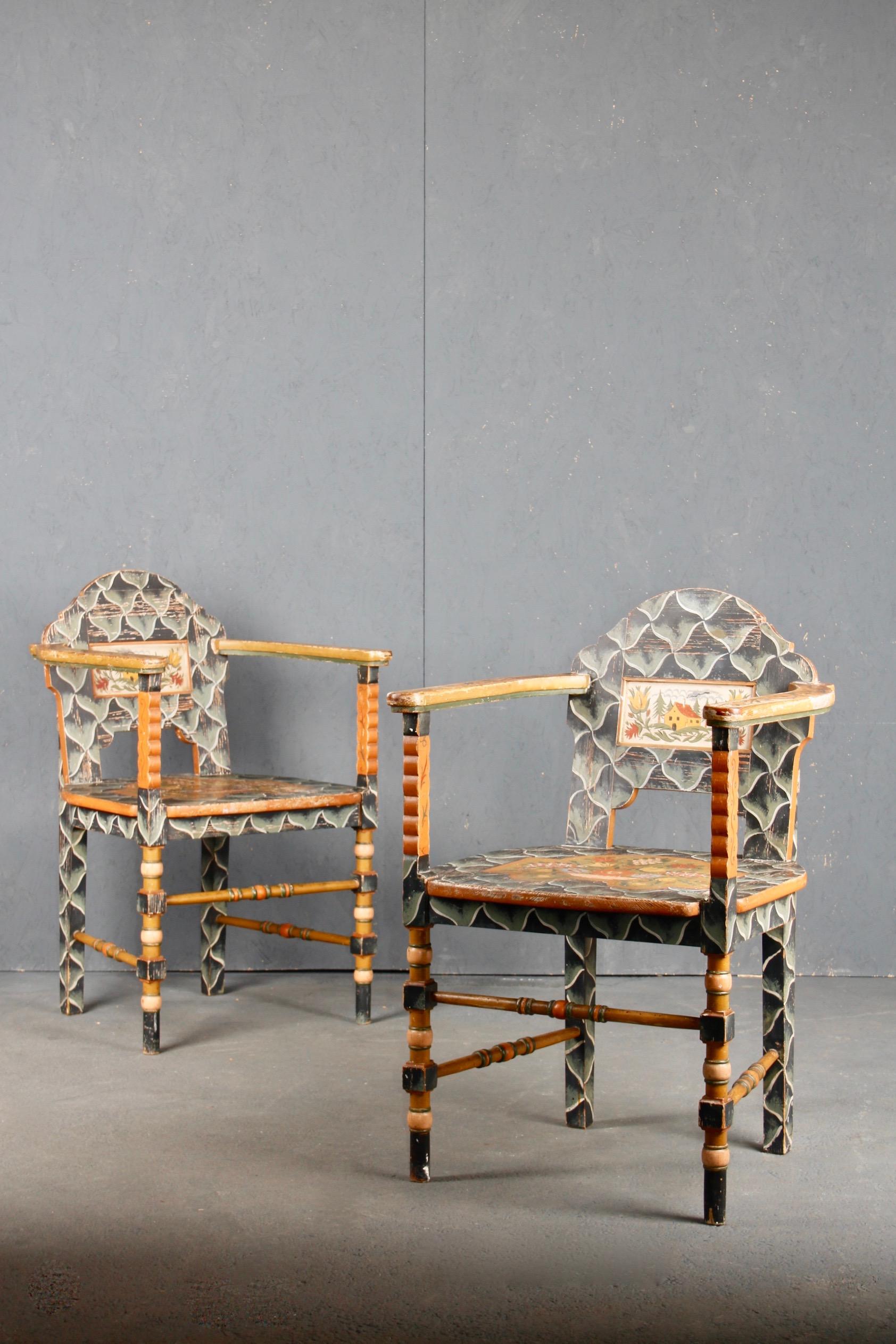 Swiss alpine Folk Art painted pair of armchairs, two small pieces of wood are missing from the back of an armchair, see the photo.
