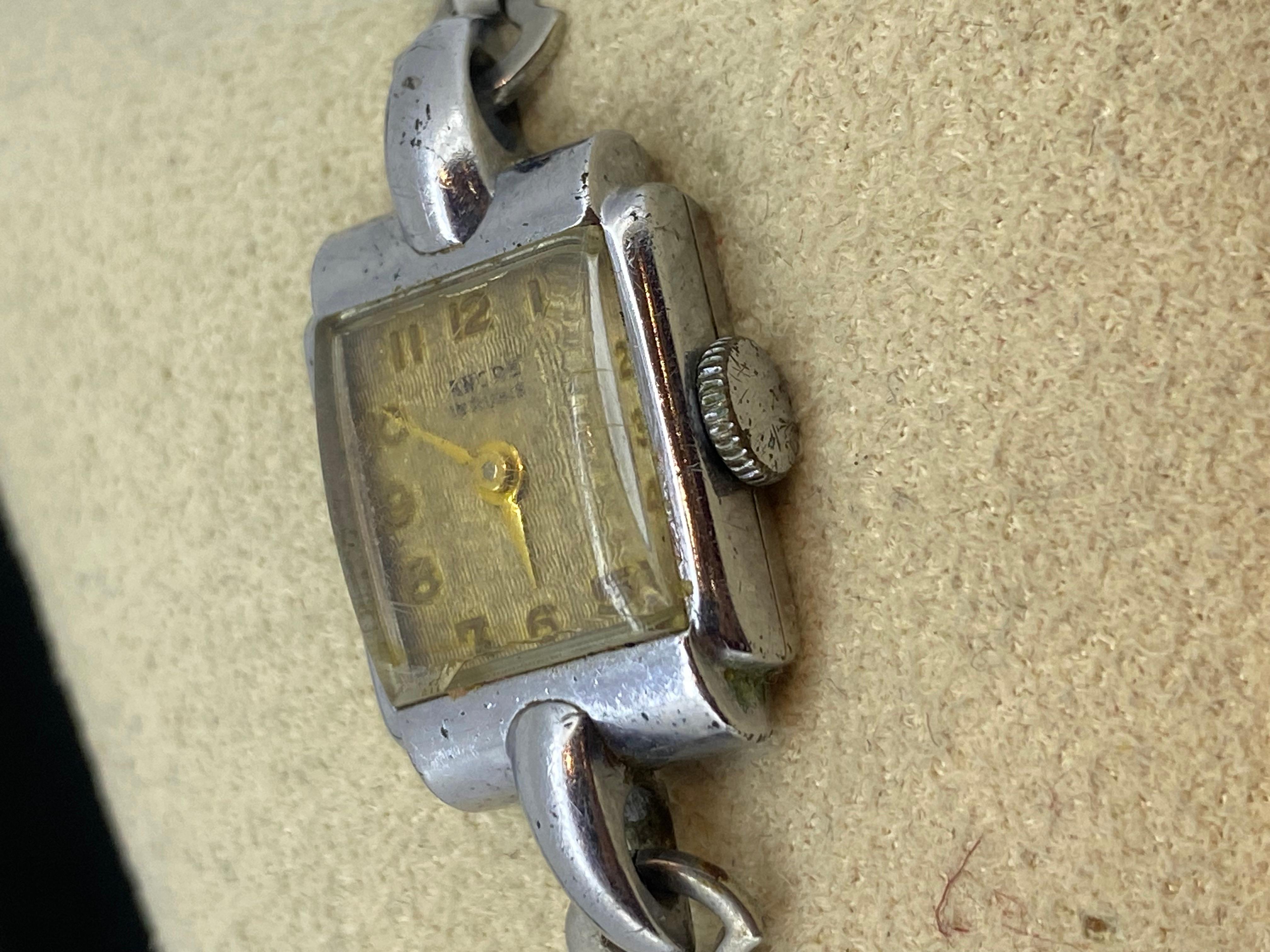 This exquisite Retro cocktail watch 
by Swiss brand Ancre 
is in good condition & great working order,
despite dating back to 1950's 

An attention-grabbing rectangle Case
is performed in Stainless Steel
It features rarely seen elegant single