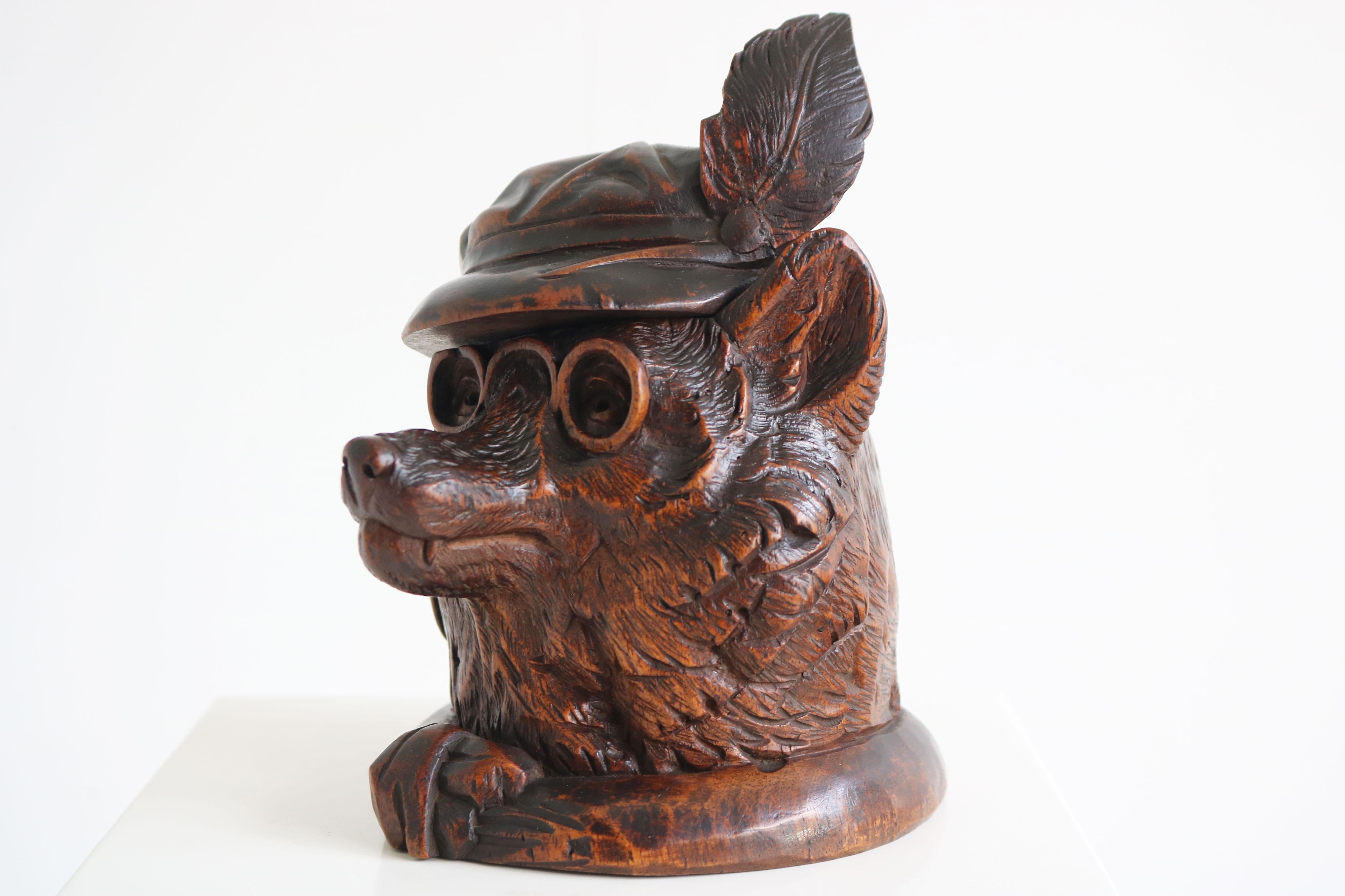 Gorgeous most rare Swiss Black Forest 19th century Inkwell / desk accessory fully hand carved displaying a dog wearing a hat and monocle 
Detailed carving by a master carver. Comes with original glass insert (rare these are often lost) 
Really nice