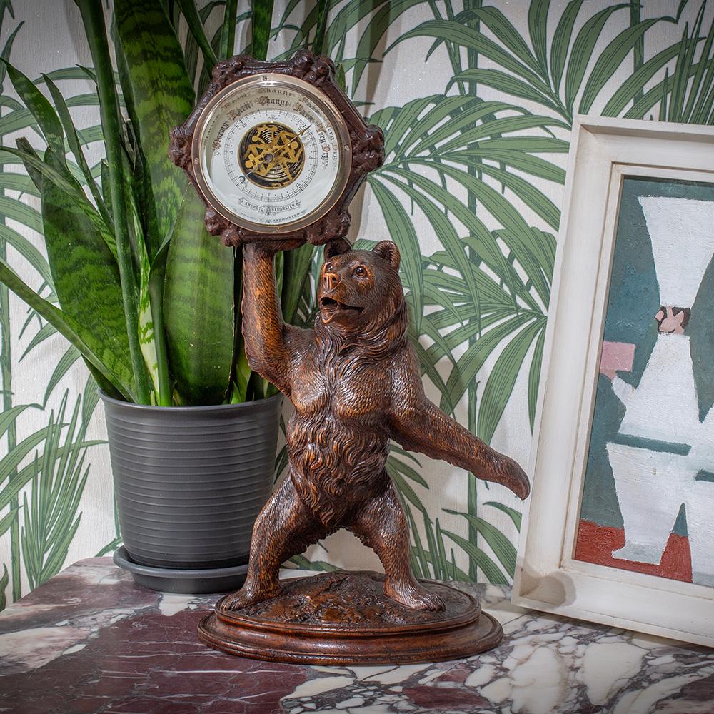 FREE WORLDWIDE SHIPPING 

From our Swiss Black Forest collection, we are delighted to present this exceptional Swiss Black Forest Bear Barometer, dating to circa 1890. Expertly hand carved from rich linden wood, the bear stands upright on an oval