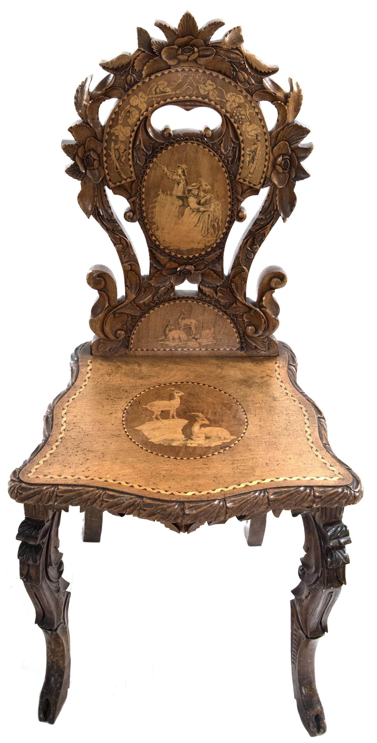 Swiss Black Forest Carved Marquetry Tilt-Top Table and Six Chairs 1