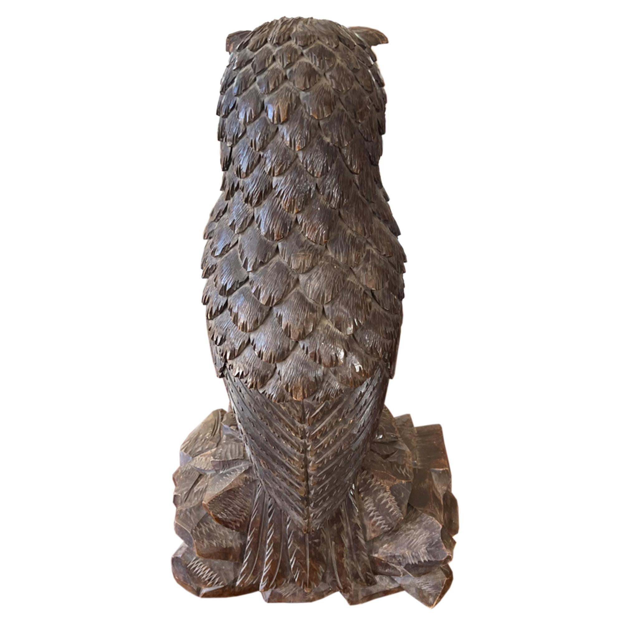 A delightful decorative owl.

This finely hand carved Black Forest carved owl sculpture demonstrates incredible workmanship and attention to detail, along with his/her beautiful glass eyes.

Please look at all our pictures to see the detail on the