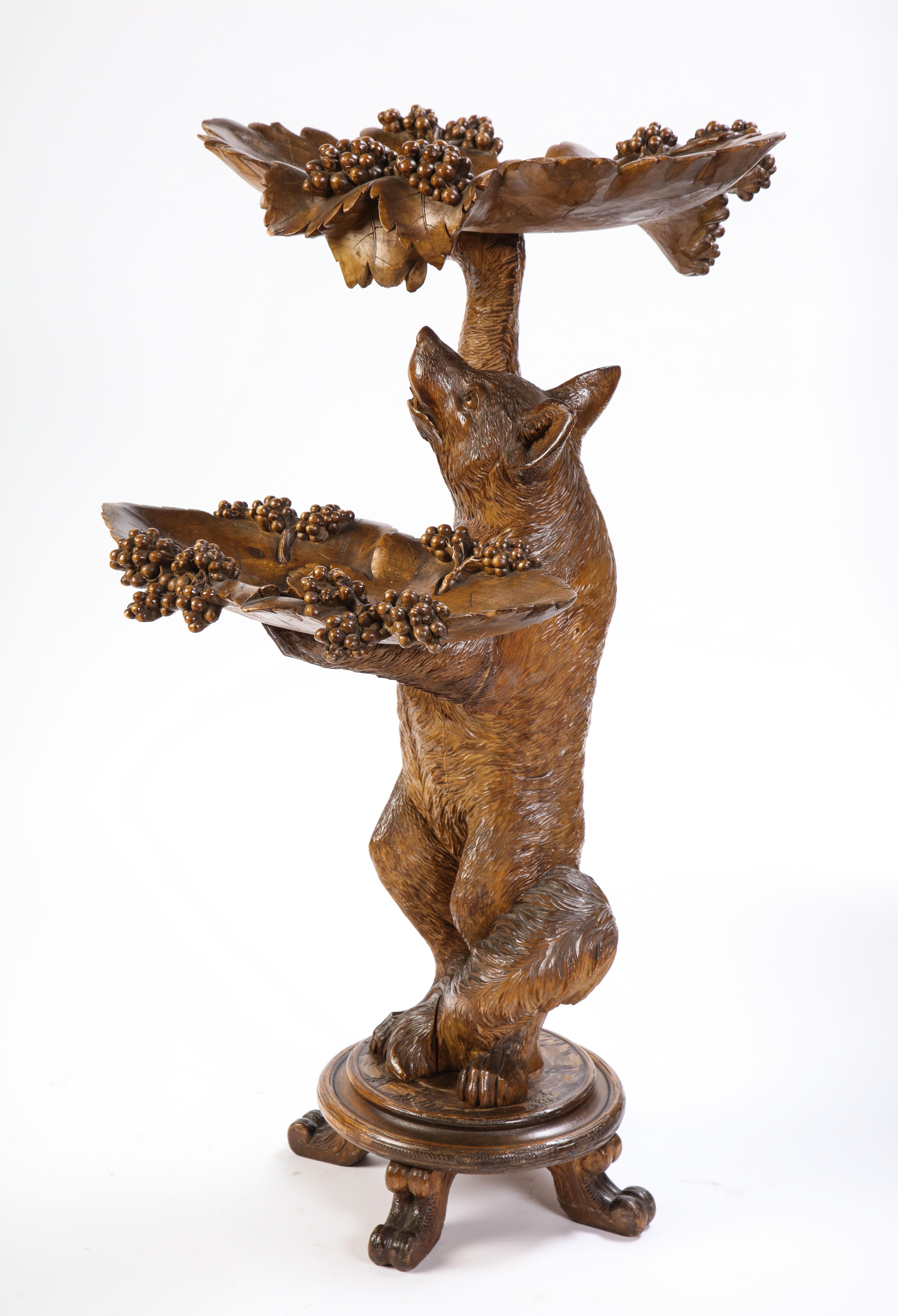 Swiss 'Black Forest' vide poche, early 20th century. Modeled as a fox holding two rotatable leaf and vine-form trays.

With a clean, complete well-maintained appearance, structurally sound and ready to use. With general overall marks, nicks,