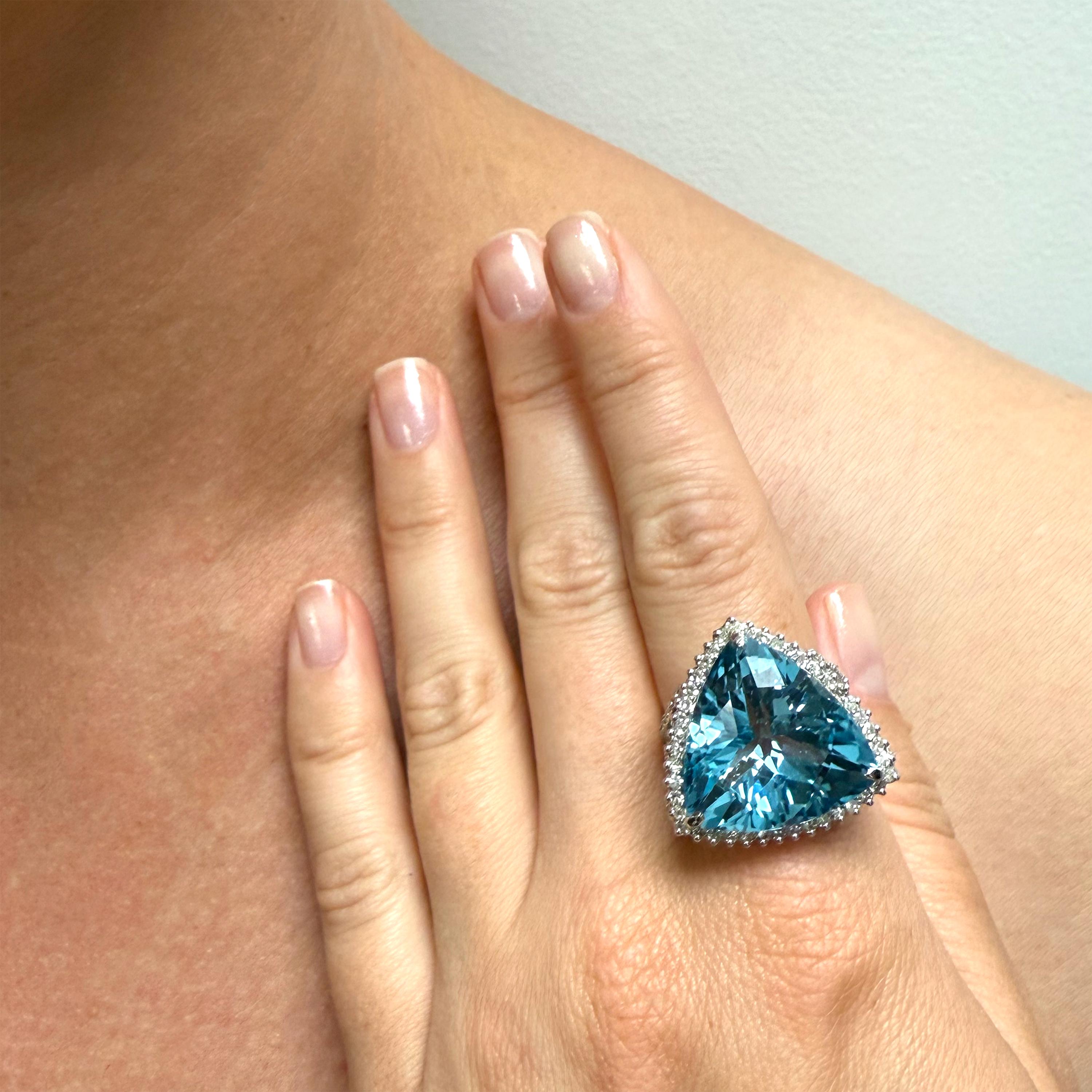 Description
Stunning vibrant Swiss Blue Topaz with pave diamonds ring.
Item # R150

Materials and Weight
Swiss blue topaz, 19.8 x 11.8mm, trillion cut, 26 carats.
Pave diamonds, 1.06 carats.
14k white gold.

Dimensions
Size US 6.5
Band width