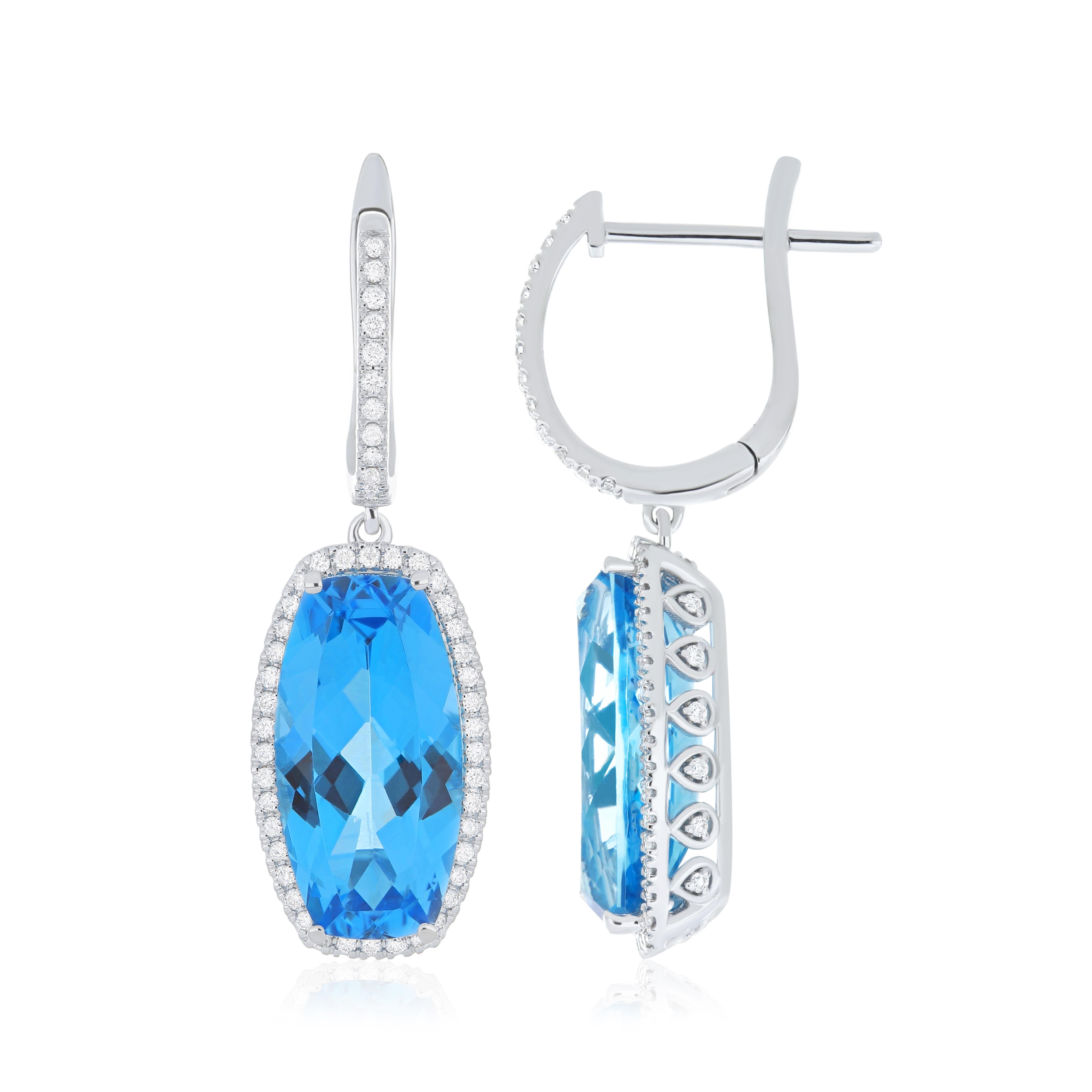 The Pendant: Indulge in the epitome of refined elegance with this masterfully crafted 18 Karat White Gold Pendant. At its heart, a breathtaking 10.15 carat (approx.) elongated cushion-shaped Swiss Blue Topaz, expertly faceted to capture the light