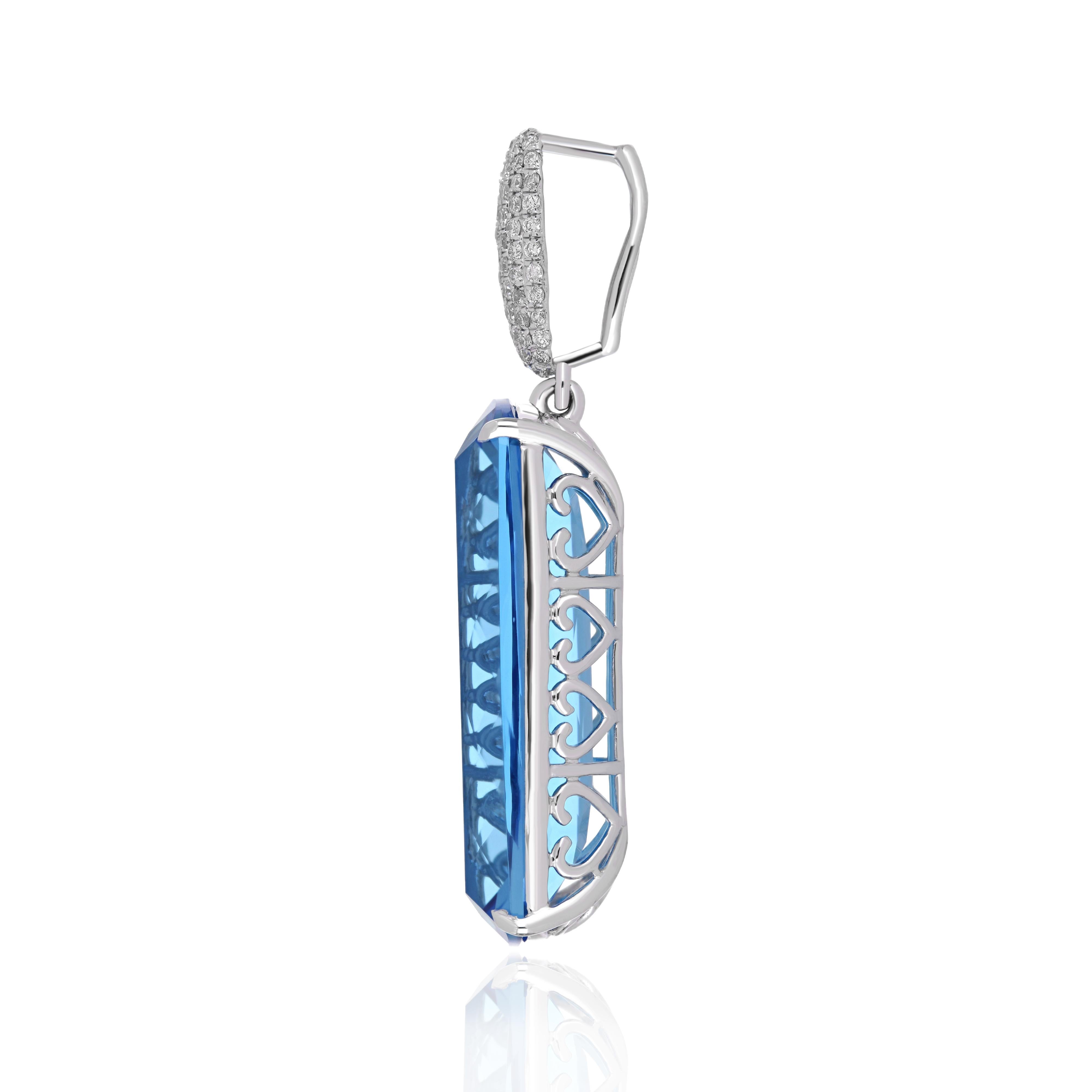 Elegant and exquisitely detailed 14 Karat White Gold Pendant center set with 19.55 CT's Cushion Shape Swiss Blue Topaz, beautifully accented with micro pave set Diamonds, weighing approx. 0.33 CT's Beautifully Hand crafted in 14 Karat White