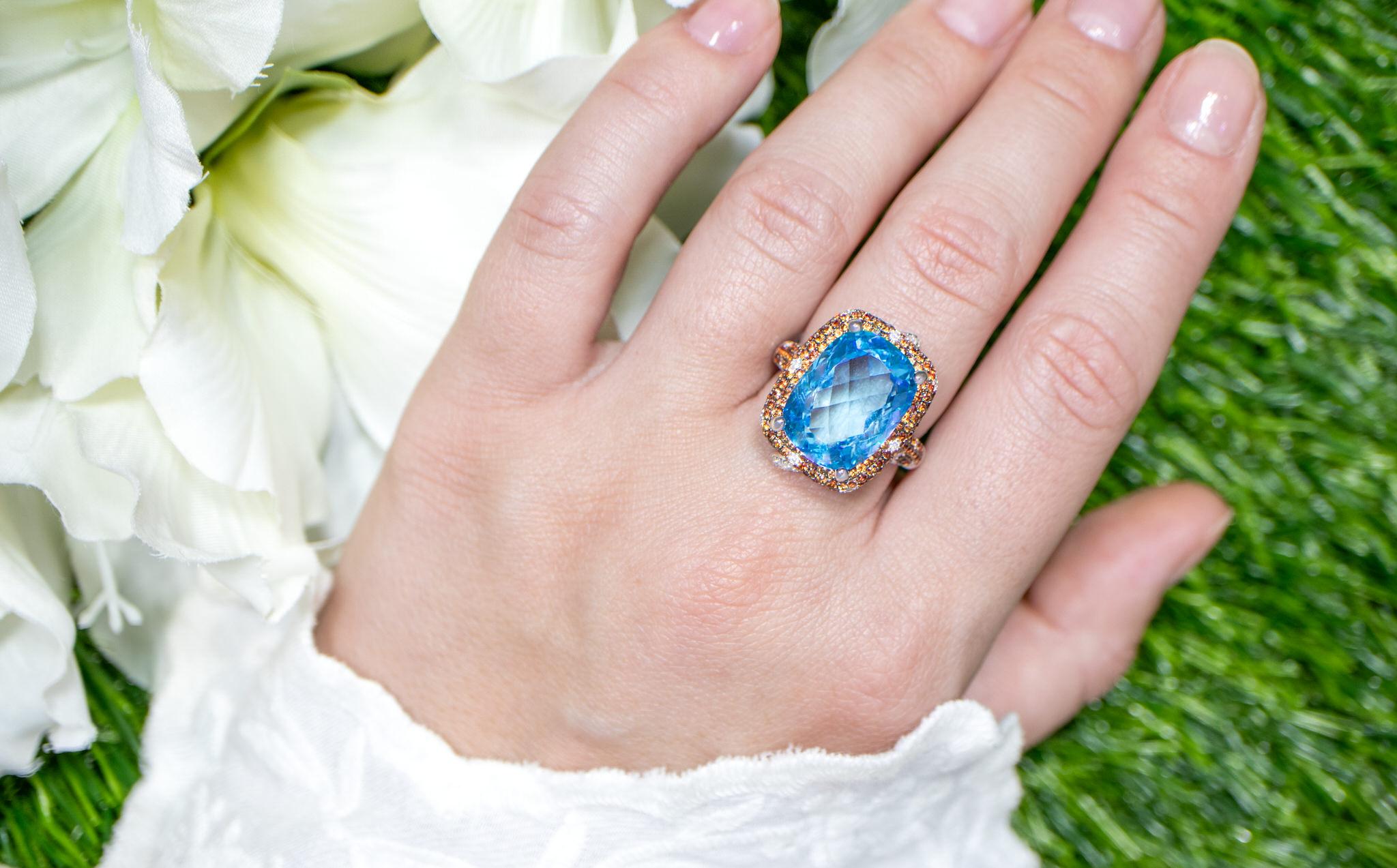 It comes with the Gemological Appraisal by GIA GG/AJP
All Gemstones are Natural
Swiss Blue Topaz = 11.26 Carat
Orange Sapphires = 1.64 Carats
Diamonds = 0.51 Carats
Metal: 18K White Gold
Ring Size: 7* US
*It can be resized complimentary