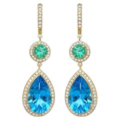 Pendants d'oreilles en or 18 carats avec topaze bleue suisse, émeraudes et diamants 15,9 carats