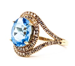Swiss Blue Topaz & Diamond Halo Ring in 14k Yellow Gold