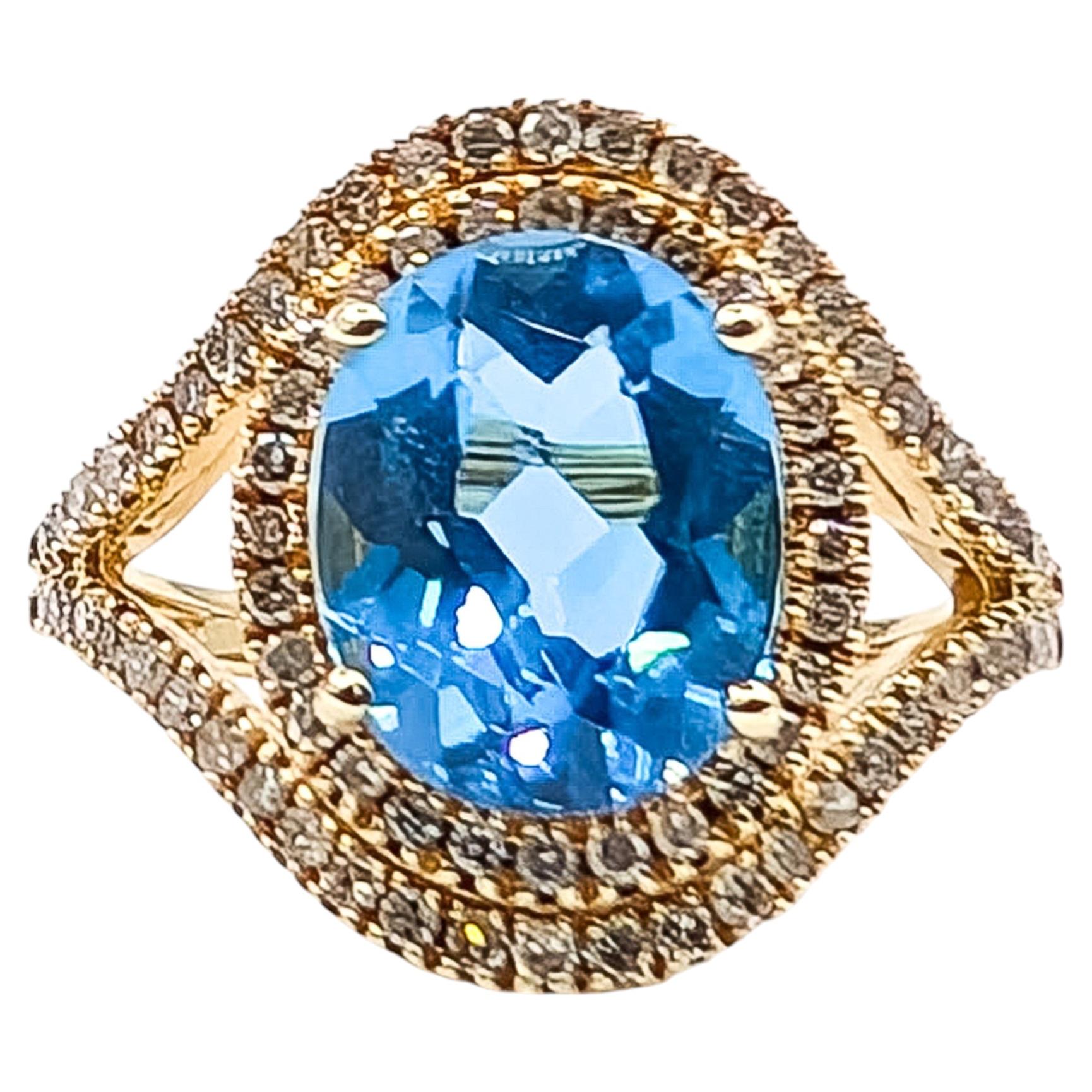 Swiss Blue Topaz & Diamond Halo Ring in 14k Yellow Gold