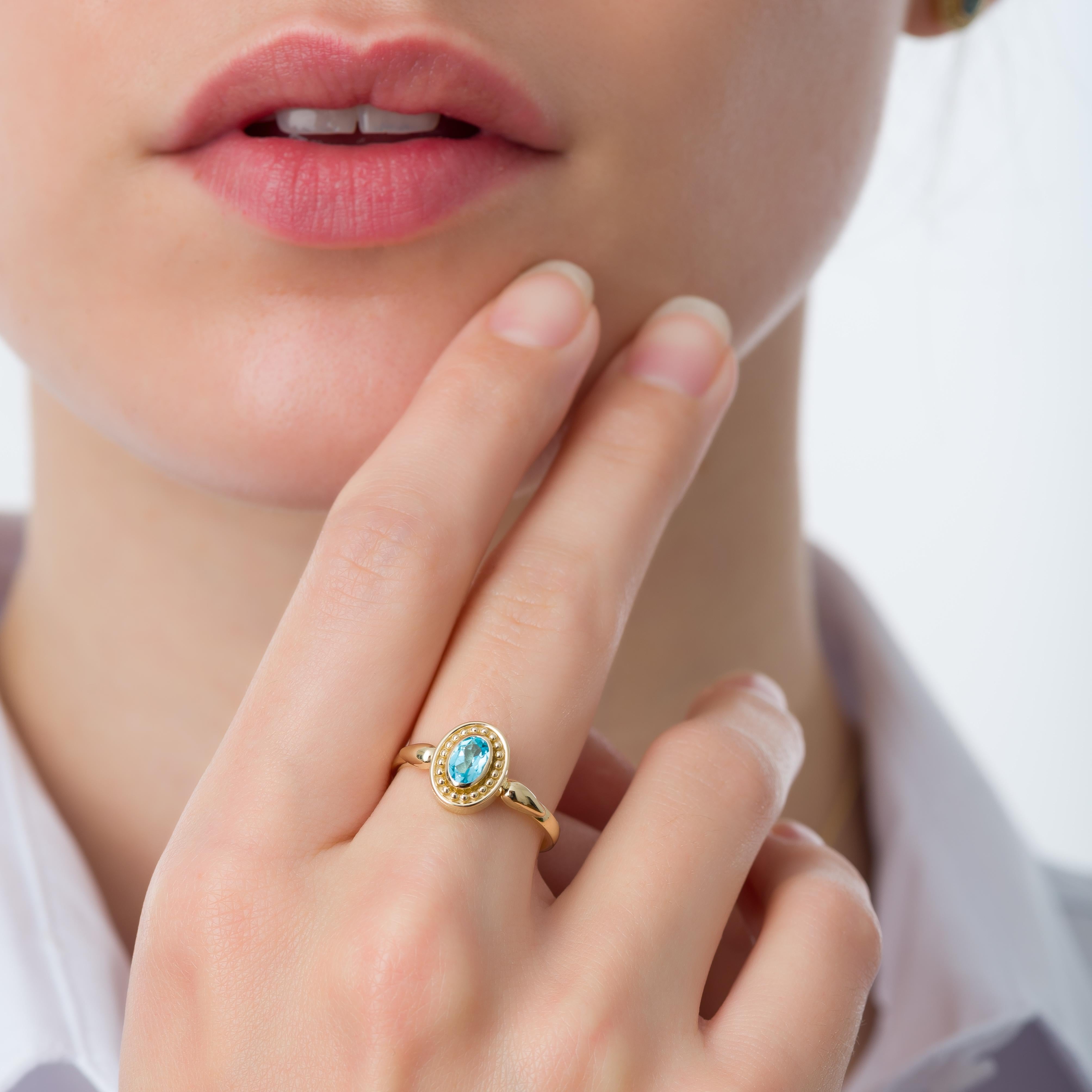 An enchanting oval Swiss topaz, cradled within a gold ring, whispers tales of nature's elegance and timeless allure, inviting you to embrace its captivating charm.

100% handmade in our workshop.

Metal: 18K Gold
Gemstones: Swiss Blue Topaz  weight