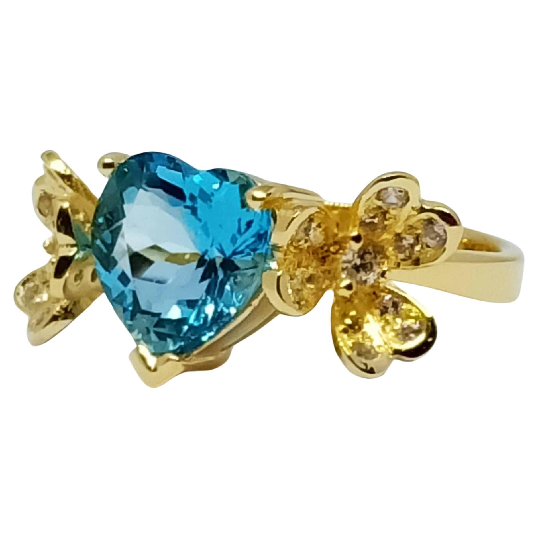 Swiss blue topaz heart ring ( 4.06cts) silver in 18k gold plated. For Sale