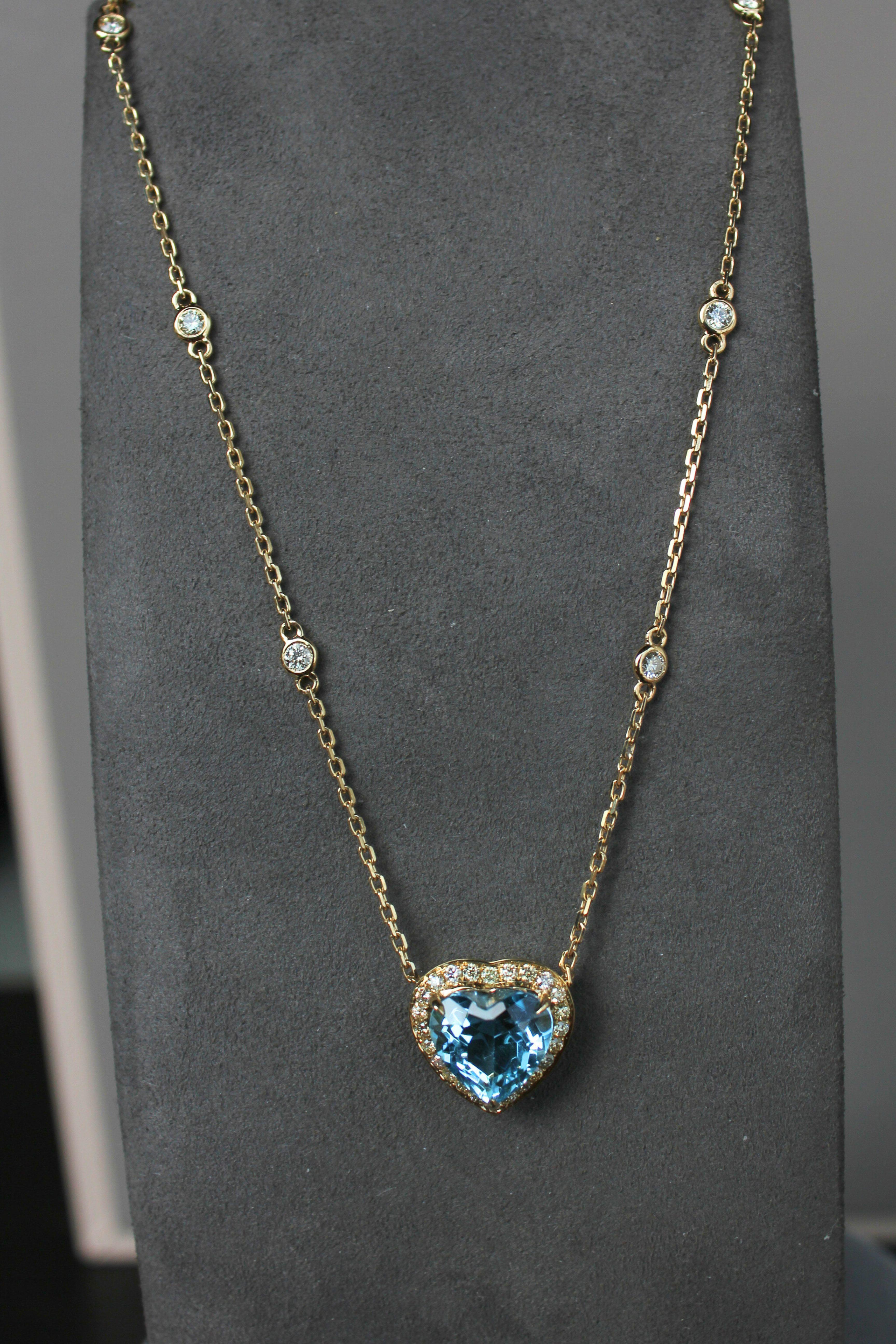 Embrace the refined beauty of this exquisite gemstone heart-shape pendant necklace.  Crafted with solid 18K gold and intricate detailing, the necklace features the highest-quality faceted diamond-cut chain that gracefully holds a natural brilliant