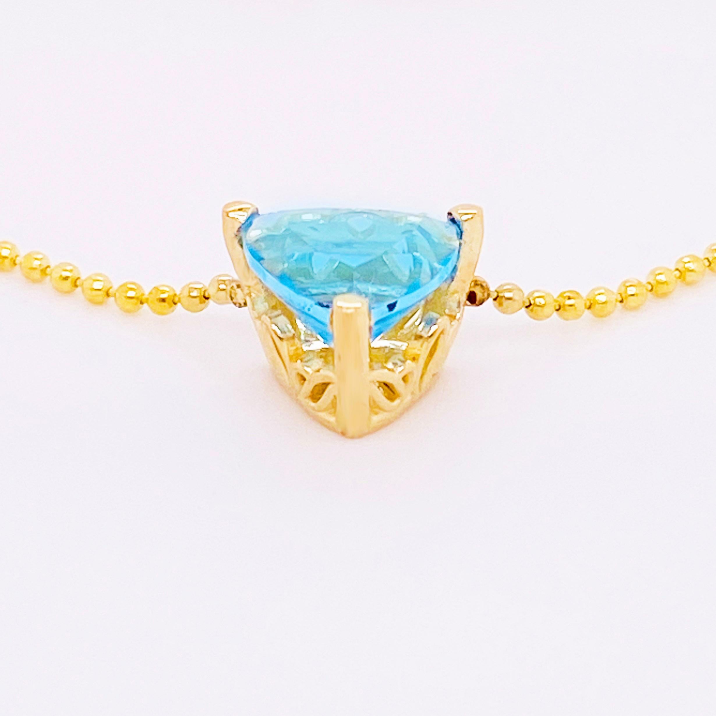 Schweizer Schweizer Blautopas Halskette 14 Karat Gold Anhänger Trillion #NeckMess Krone, Perlen (Trillionschliff)