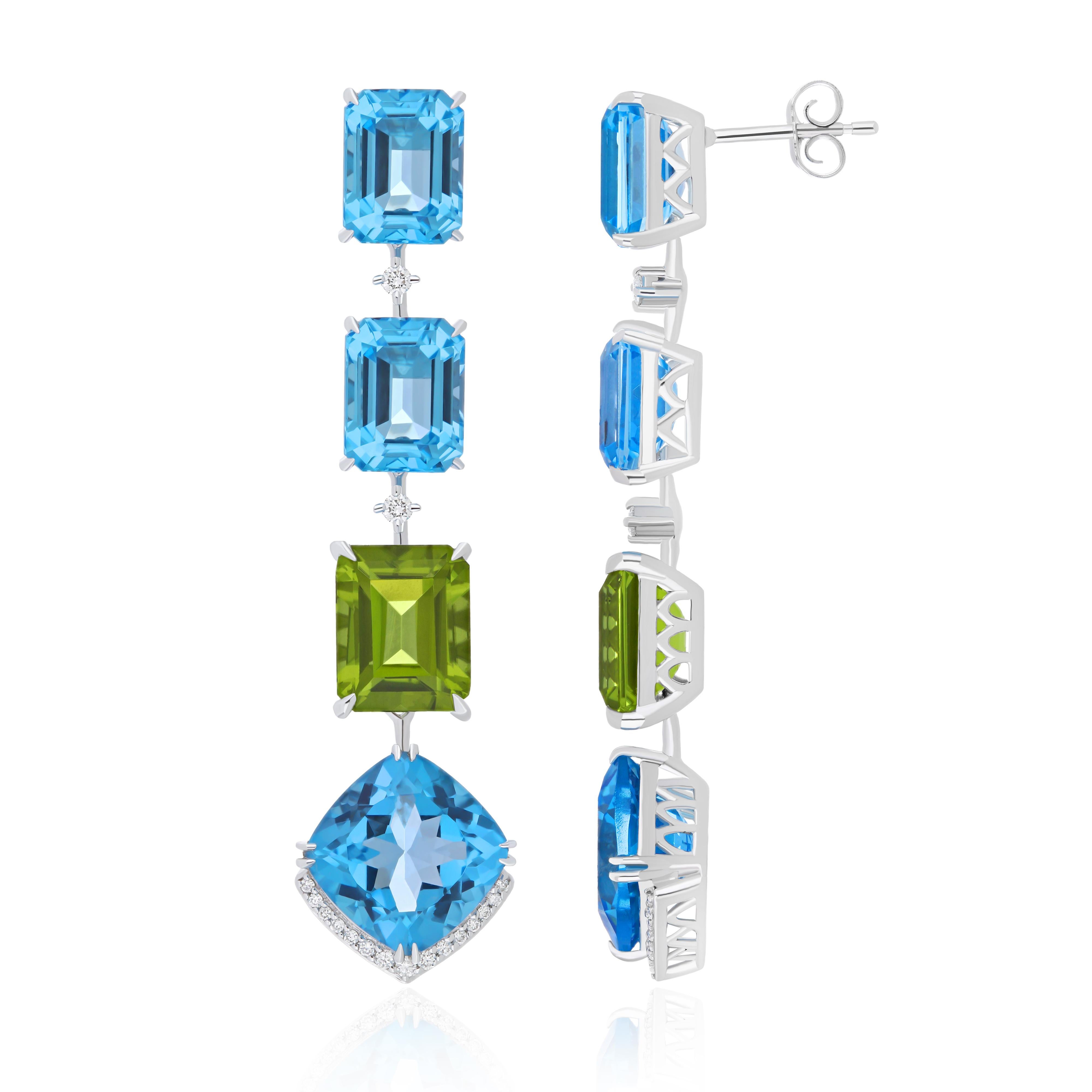 Elegant and Exquisitely Detailed 14 Karat White Gold Earrings set with Octagon Shape Swiss Blue Topaz with approx. 22.30 Cts (approx Total) and contrasting octagon  Peridot approx. 7.70Cts in Octagon Shape, accented with 0.21 cts  Diamond.