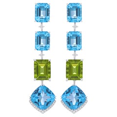 Pendiente de regalo de cumpleaños de oro blanco de 14 quilates con topacio azul suizo, peridoto y diamante