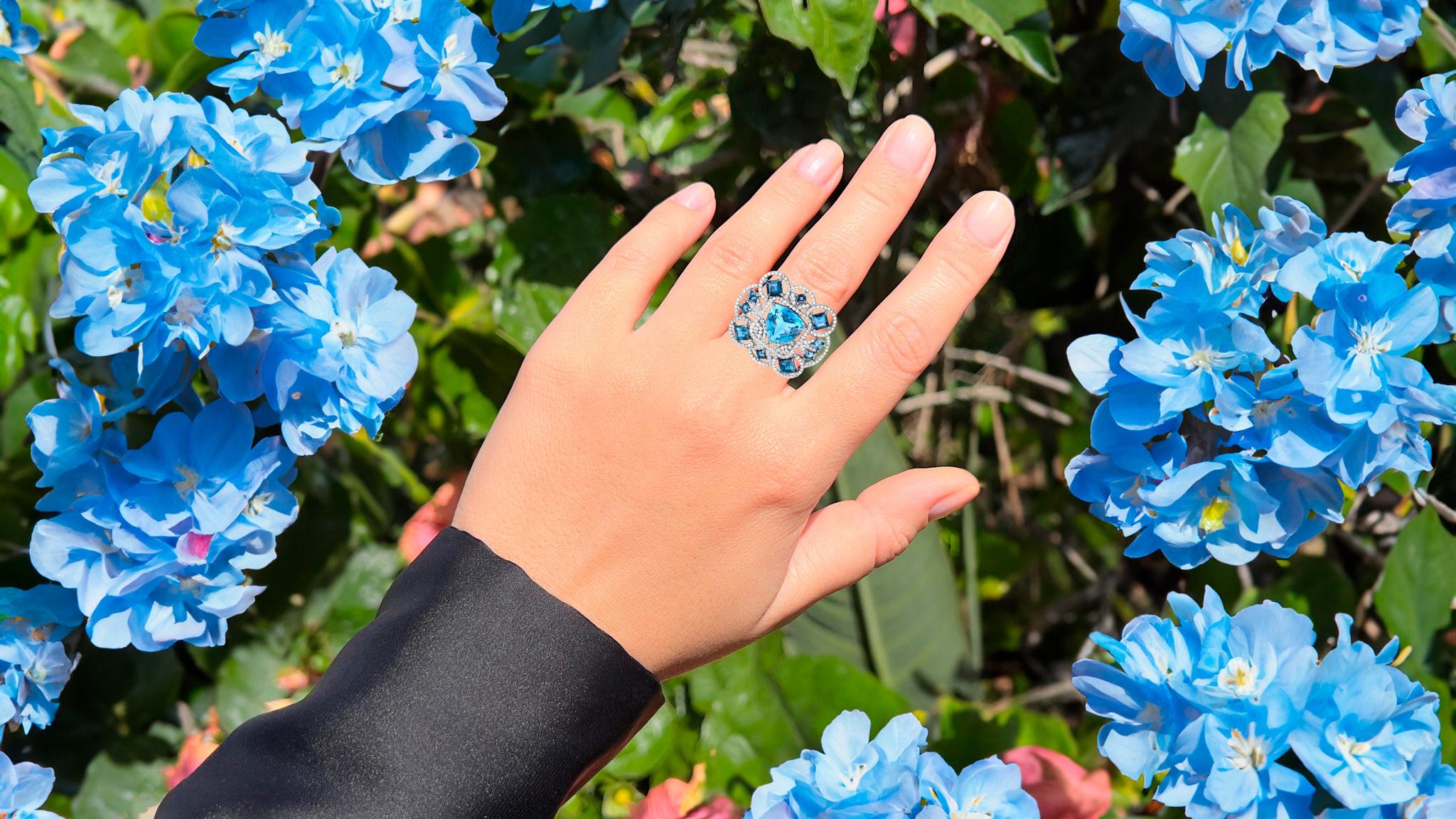 It comes with the Gemological Appraisal by GIA GG/AJP
All Gemstones are Natural
Swiss Blue Topaz = 7.95 Carat
10  London Blue Topazes = 4.30 Carats
218 Diamonds = 1.62 Carats
Metal: Black Rhodium Plated Sterling Silver
Ring Size: 7.5* US
*It can be