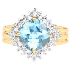 Bague en argent plaqué or avec topaze bleue suisse et topaze blanche de 4,28 carats