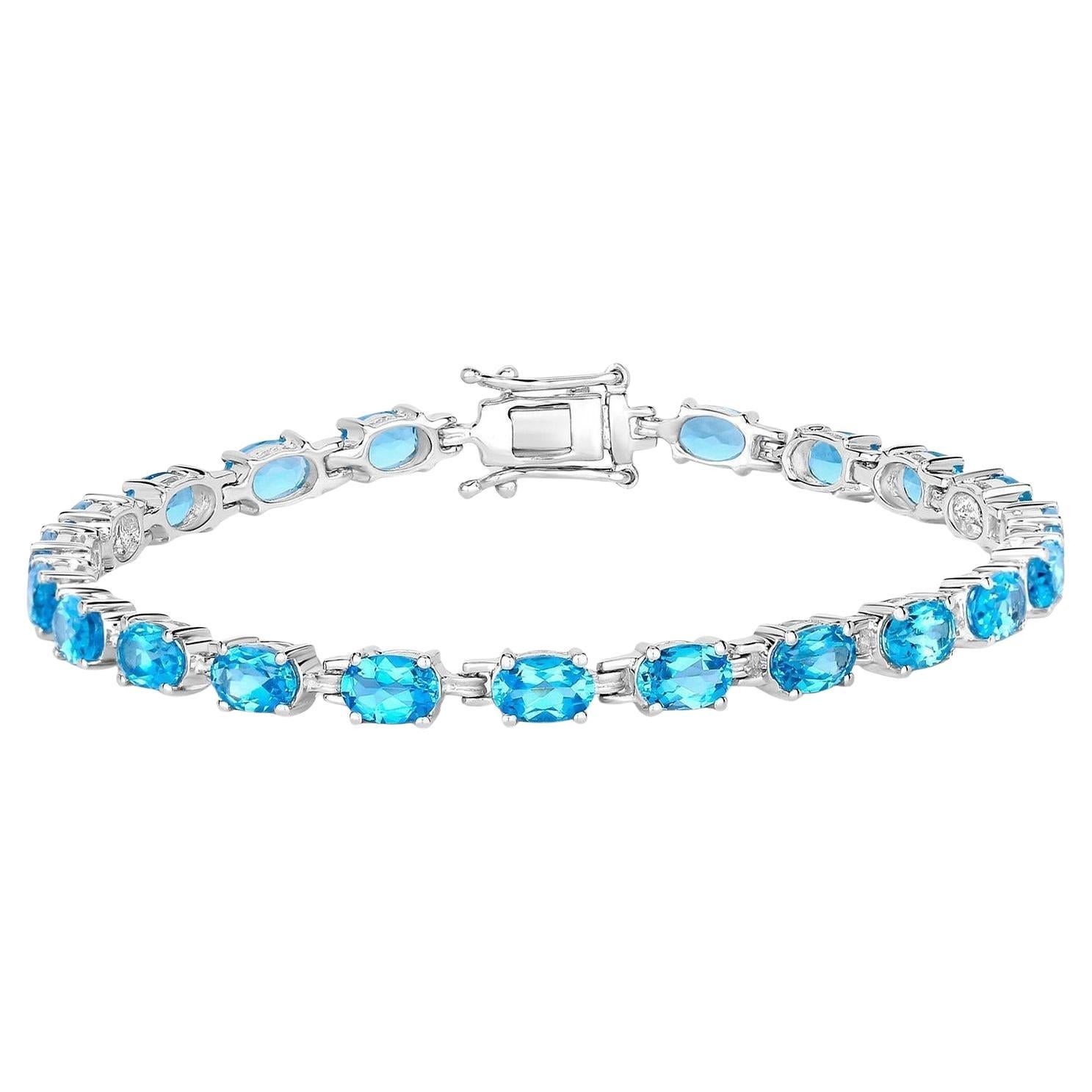 Bracelet tennis suisse de 10,7 carats en argent sterling et topaze bleue en vente