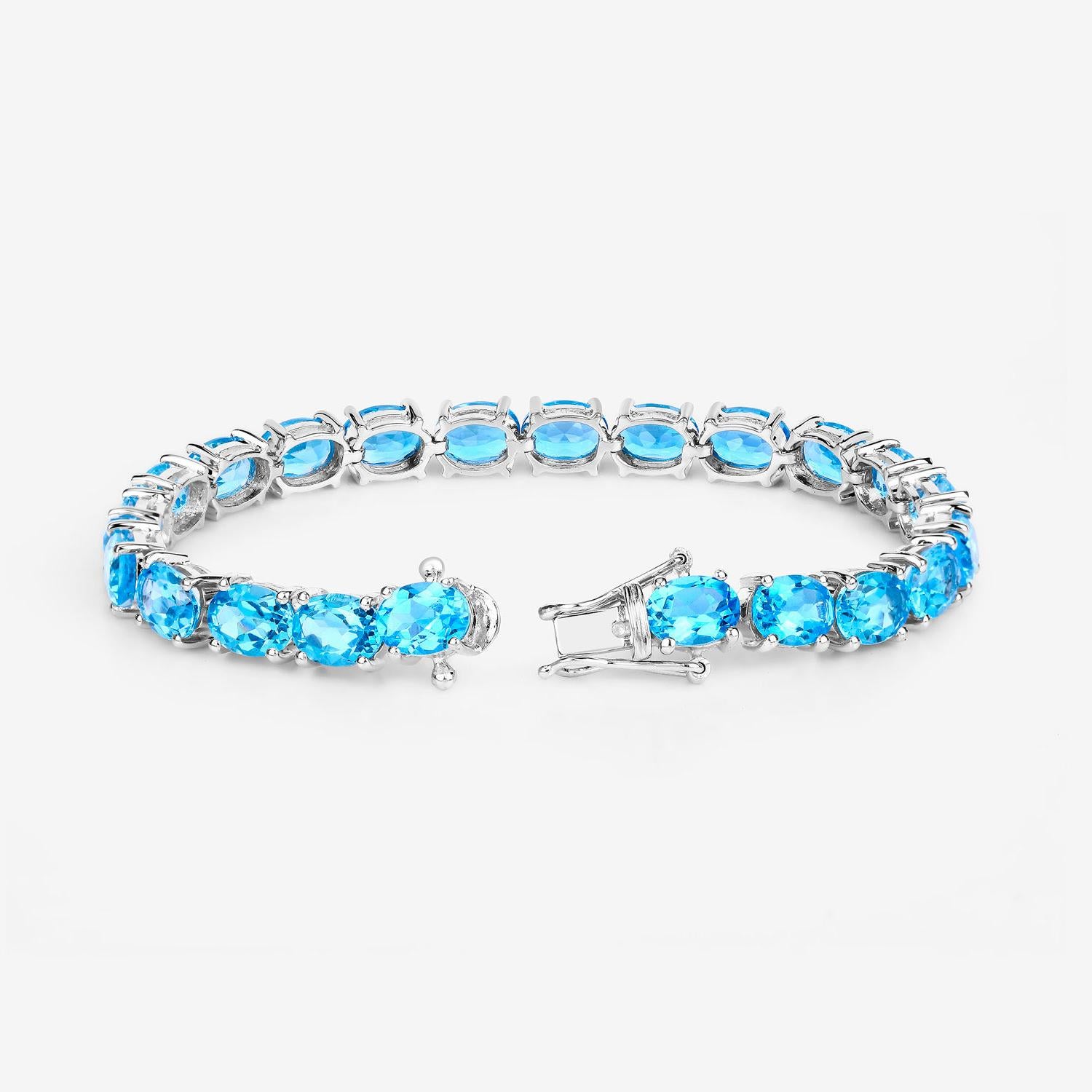 Oval Cut Swiss Blue Topaz Tennis Bracelet 35 Carats Rhodium Plated Sterling Silver For Sale