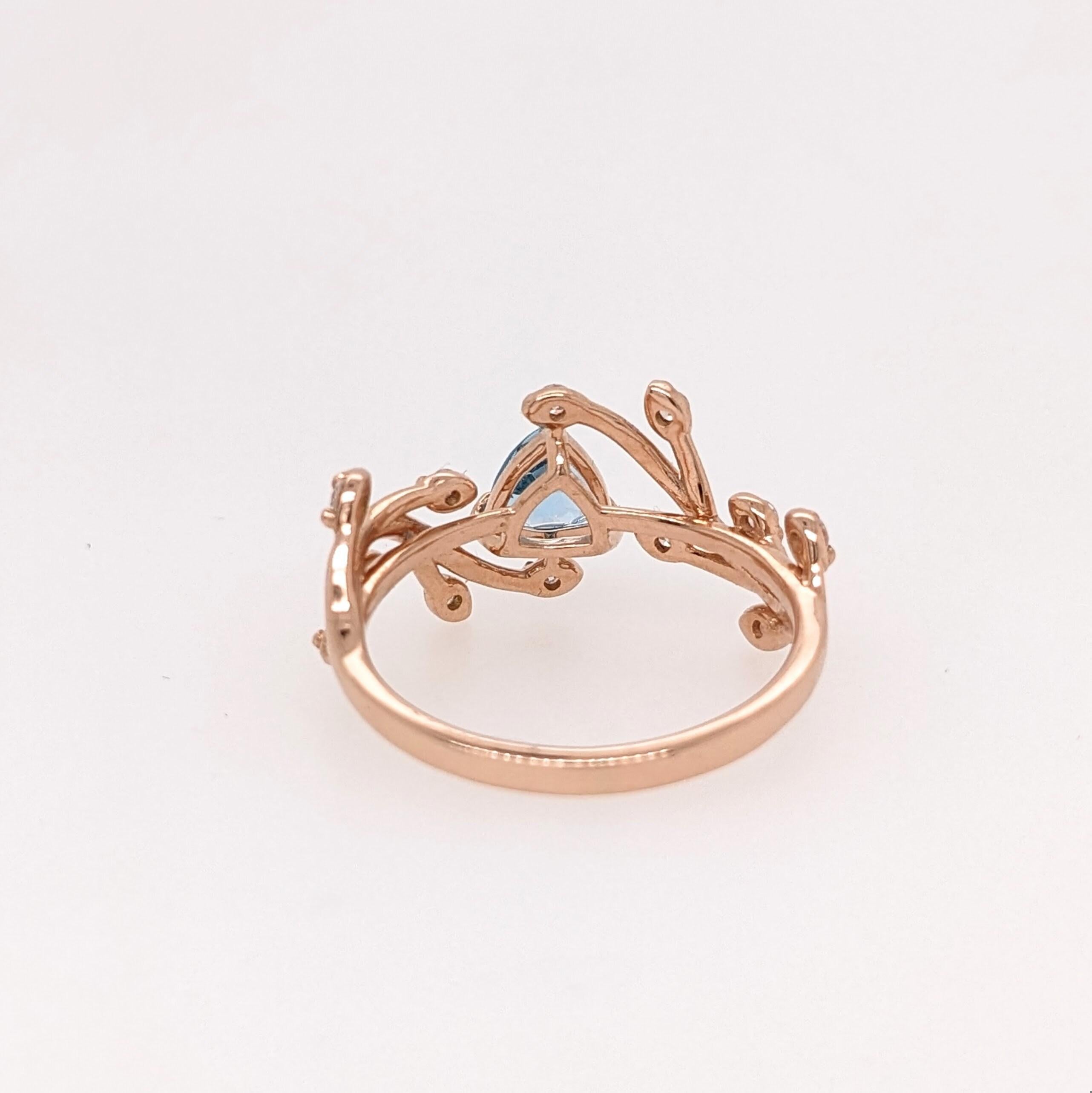 This beautiful vine ring set features a 0.65 carat earth mined Swiss Topaz with natural round earth mined diamond accents. A ring design perfect for an eye-catching engagement or anniversary. This ring also makes a beautiful December birthstone gift