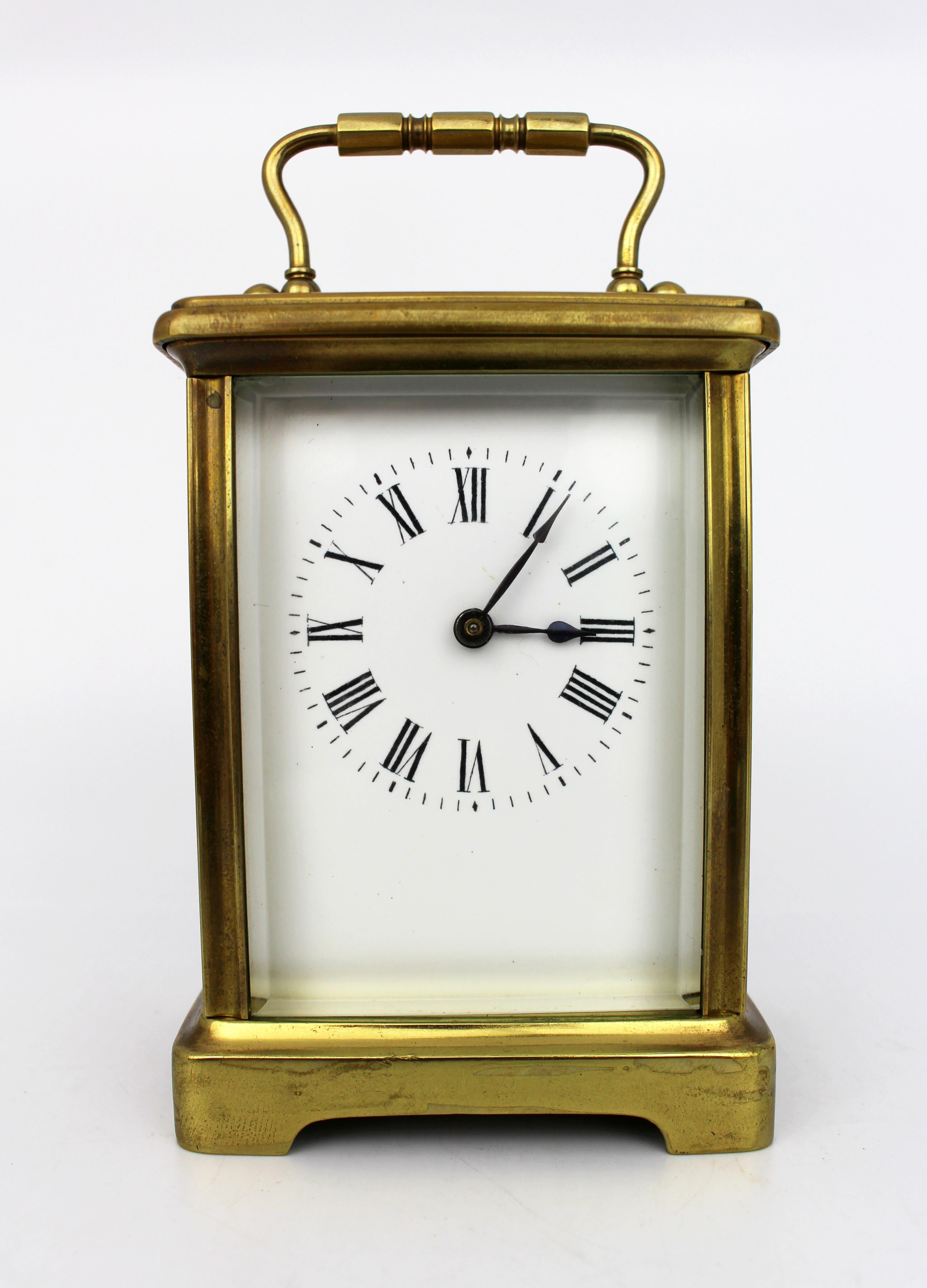 Swiss Brass Carriage Clock with Original Travel Case, circa 1910

A well-proportioned brass carriage clock dating to the early 20th century, complete with its original silk- and velvet-lined travel case and winding key.

The rectangular brass case