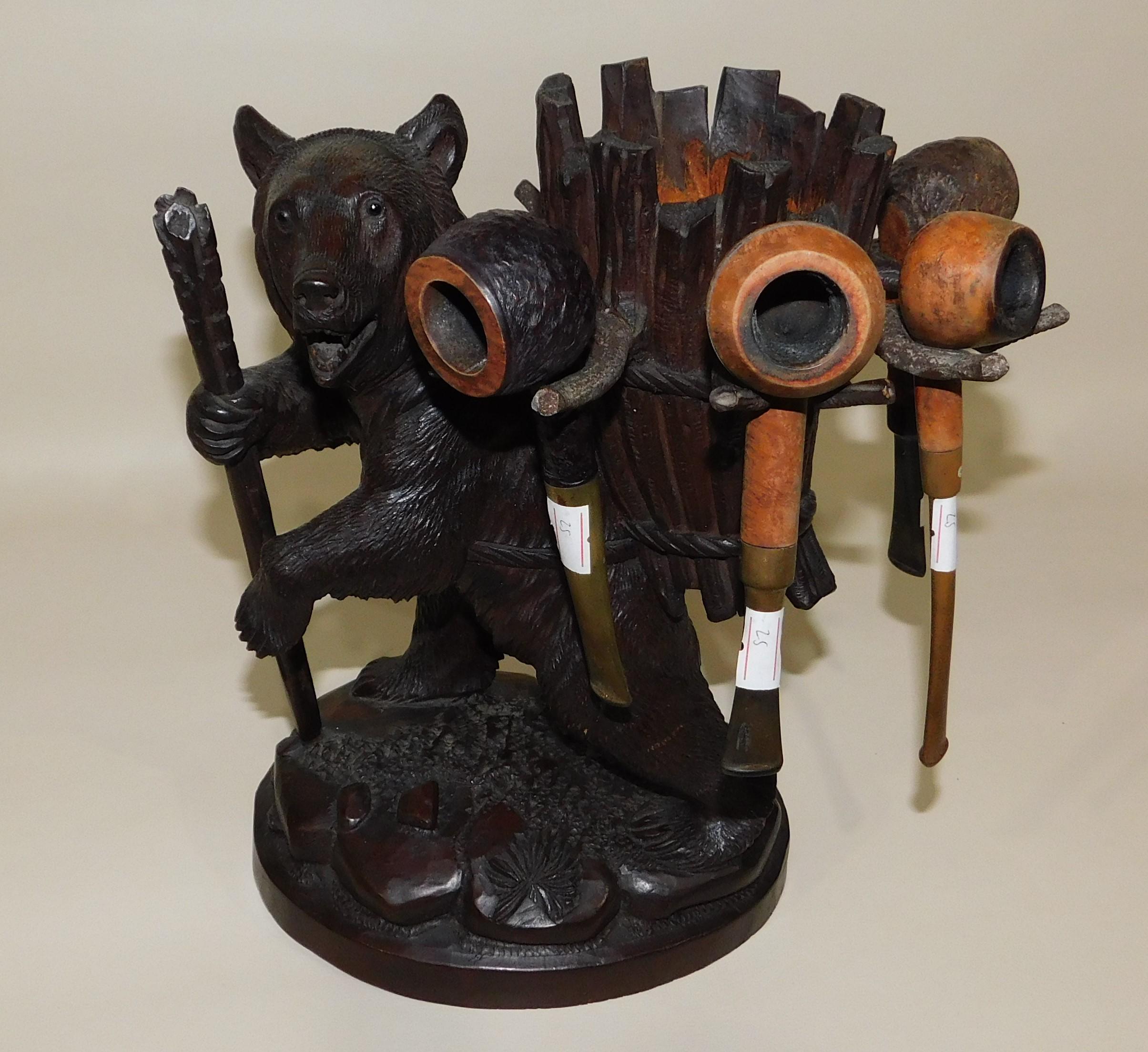 Black Forest hand-carved linden-wood hand-carved pipe tobacco holder stand also have seen examples of it used as a decanter or liqueur Stand with the holders being used for shot or small glasses. Modeled as hiking bear with walking stick and basket