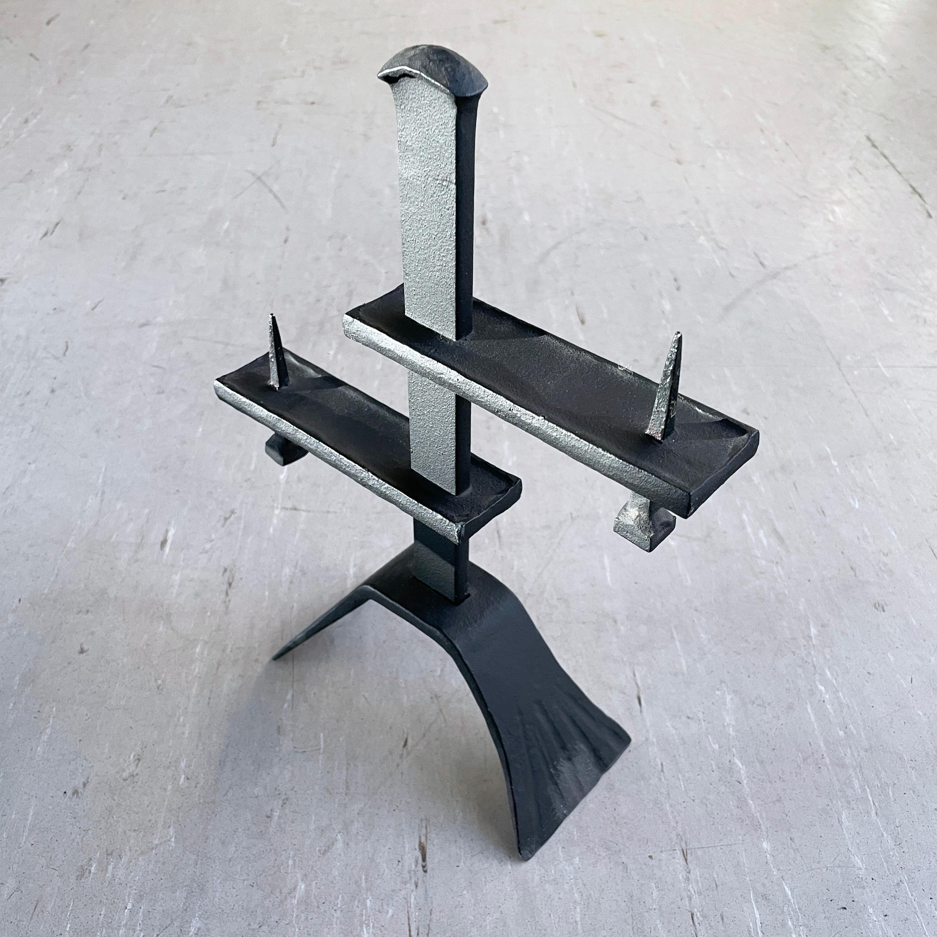 Swiss Brutalist wrought iron candle holder dating from the 1960's. 
Made by W. Müller Metalfabrik, Ersigen, Switzerland. With placement for two candle holders. Original makers label attached.
Height: 30cm / Width: 22cm / Depth: 8cm