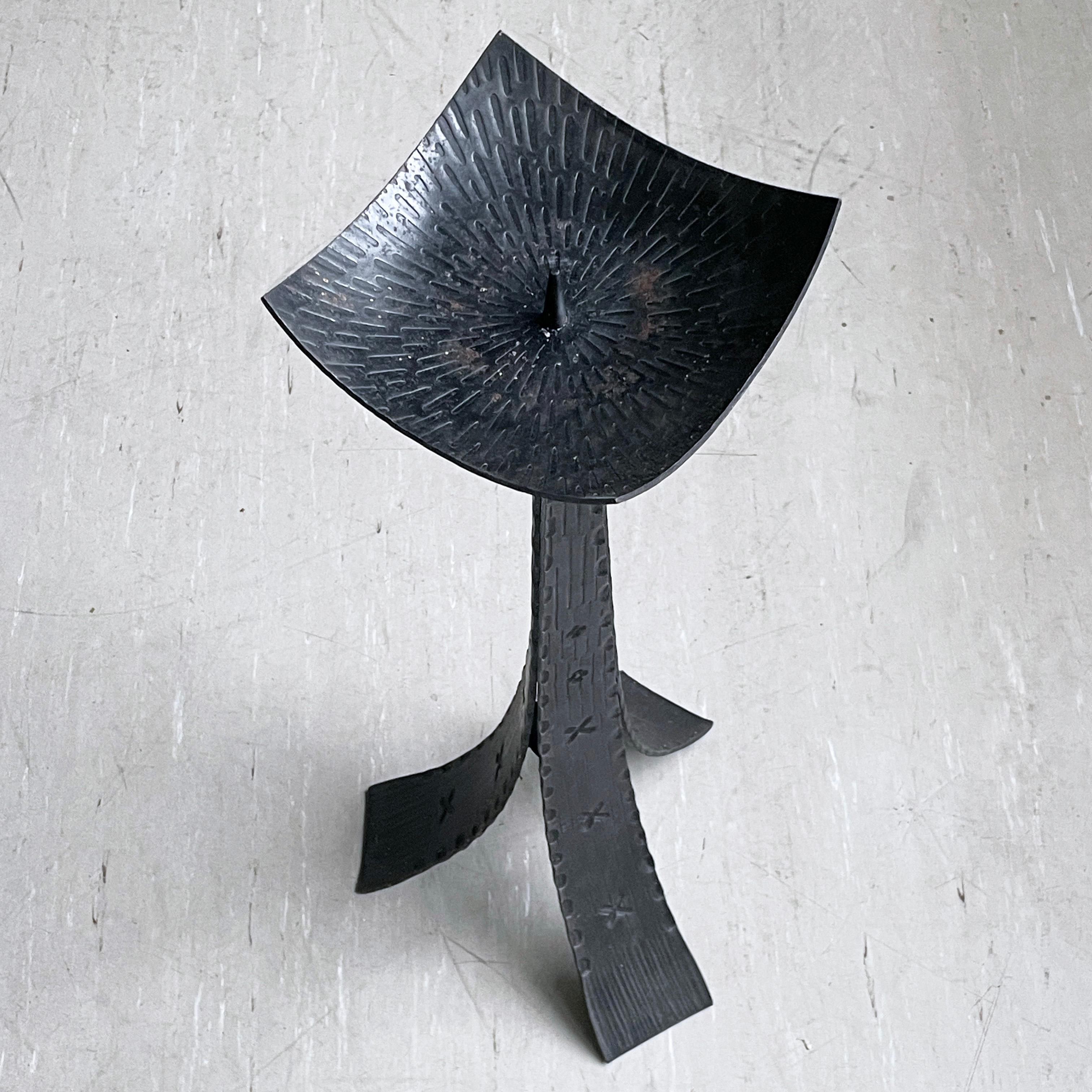 Large Brutalist floor standing wrought iron candle holder dating from the late 1950's - early 1960's. With single candle holder on a decorated tripod base. Believed to be of Swiss origin. A lovely decorative piece which would compliment any living