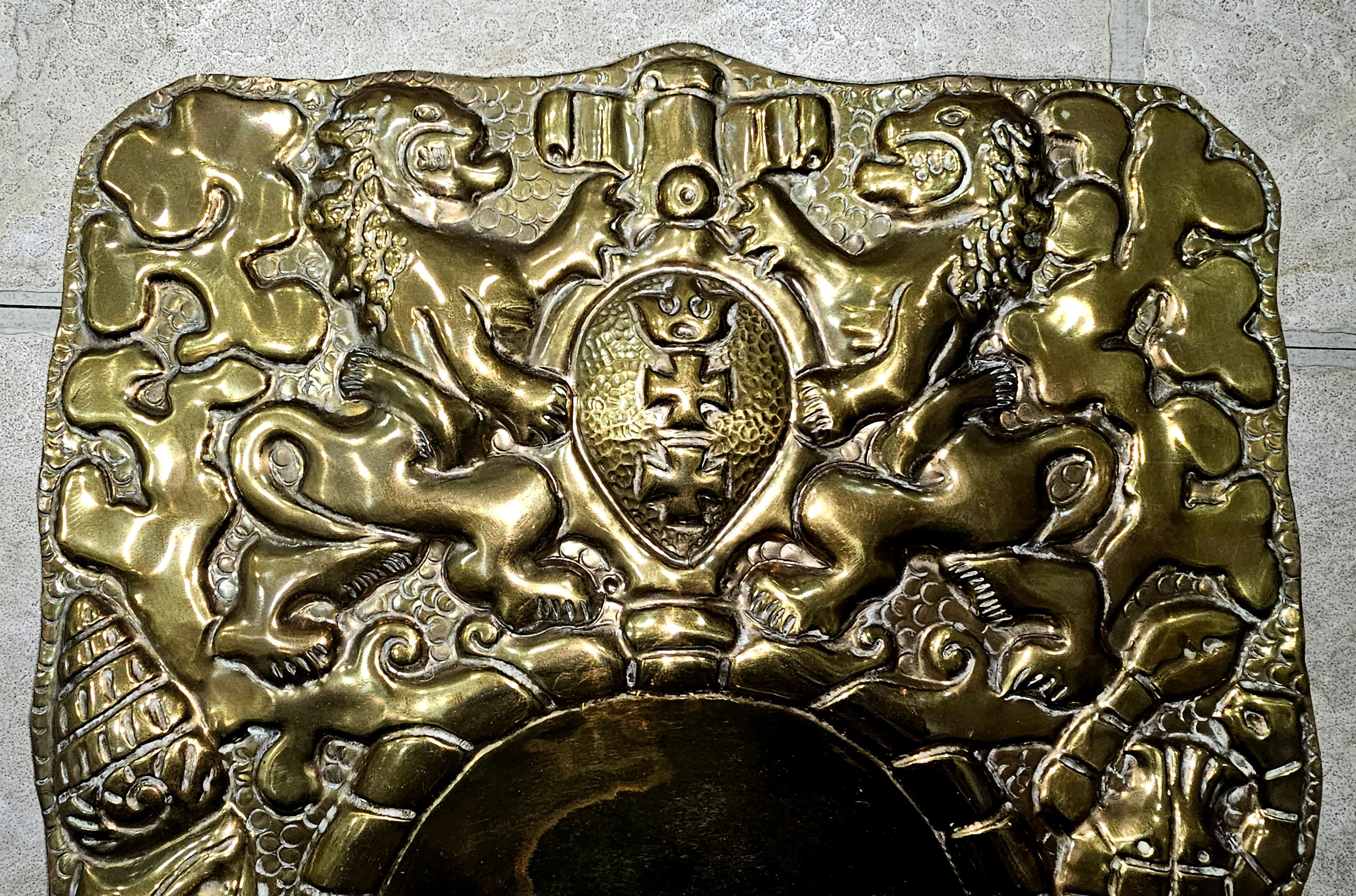 A Pair of Swiss Coat of Arms Lion Heraldry Repoussé Brass Candle Sconces featuring the Swiss Coat of Arms and adorned with crab, snails and lobster, all in repoussé.
Measure 12