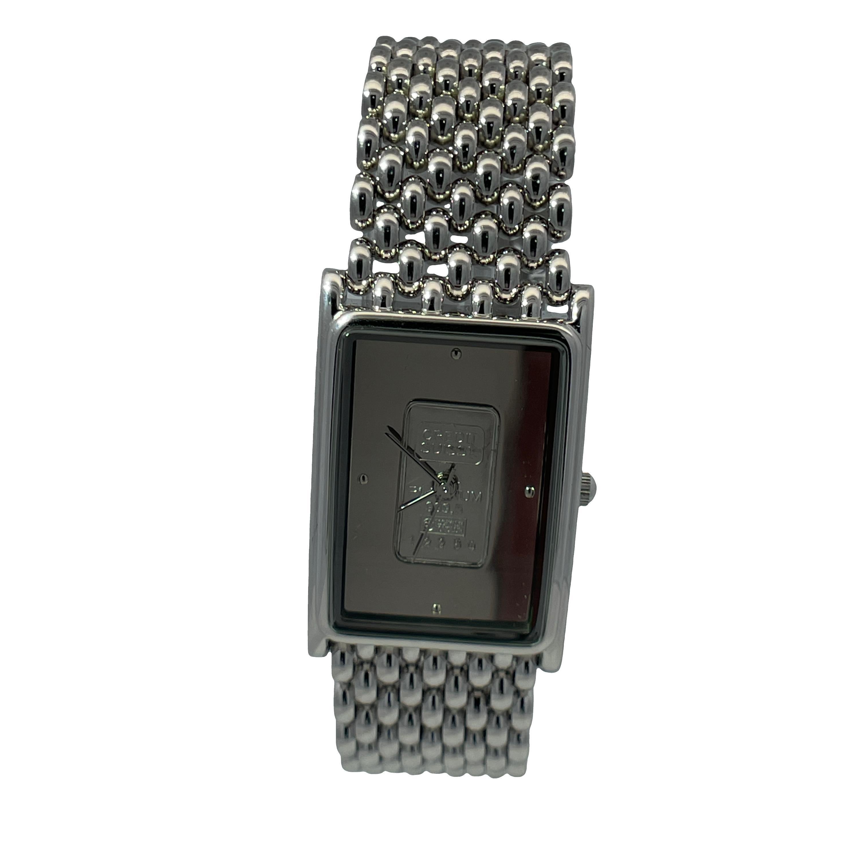Elevate your style with this exquisite silver watch, inlaid with Swiss Platinum with a remarkable 999.5 purity Credit Suisse 1g ingot. Featuring a sleek rectangular face and a durable steel case, this timepiece combines elegance and functionality.