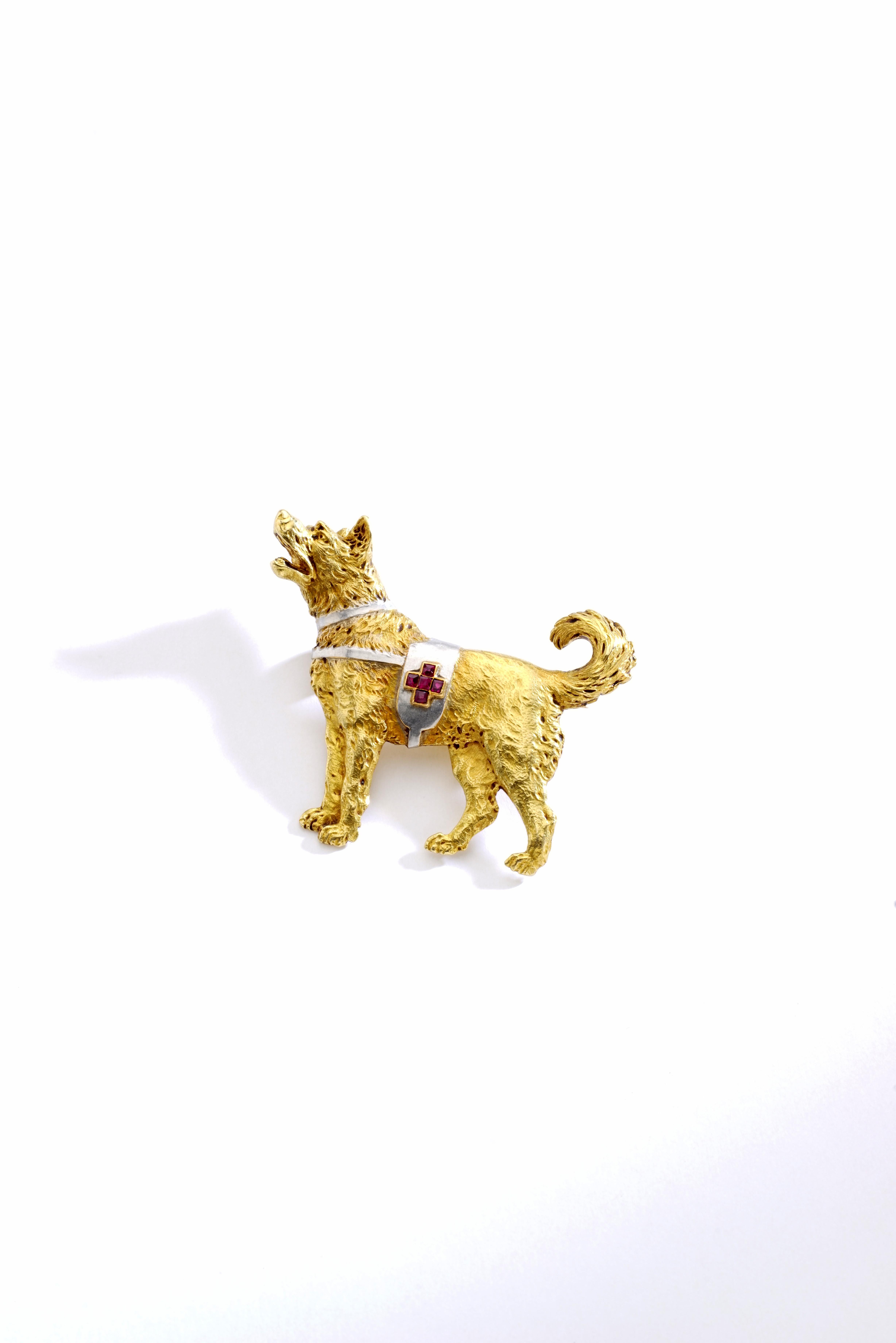 Swiss cross Rescue Dog. Ruby, Gold and Platinum Brooch.
Circa 1970. French marks.

Total length: 1.77 inch (4.50 centimeters).
Total height: 1.50 inch (3.80 centimeters).