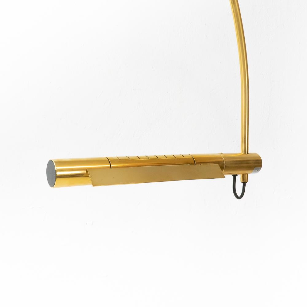 The Halo-Mobil floor lamp by Rico and Rosemarie Baltensweiler was designed in the 1970s. Our version is a special edition, in gold plated brass and produced in a limited quantity during the 1980s.

This arched floor lamp (adjustable in height) is
