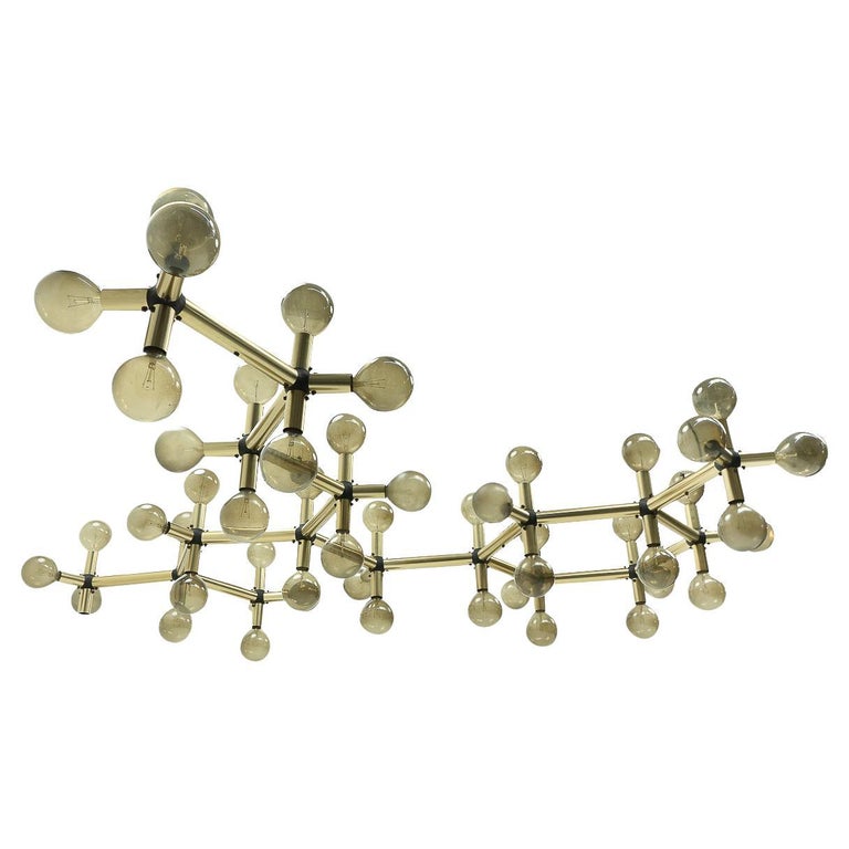An impressive, original aluminium “Atomic” ceiling lamp designed by Trix and Robert Haussmann in the 1970s, and produced by Swisslamps International.

The lamp is made of aluminium tubes and plastic connectors, it features 60 screw-in bulbs (not