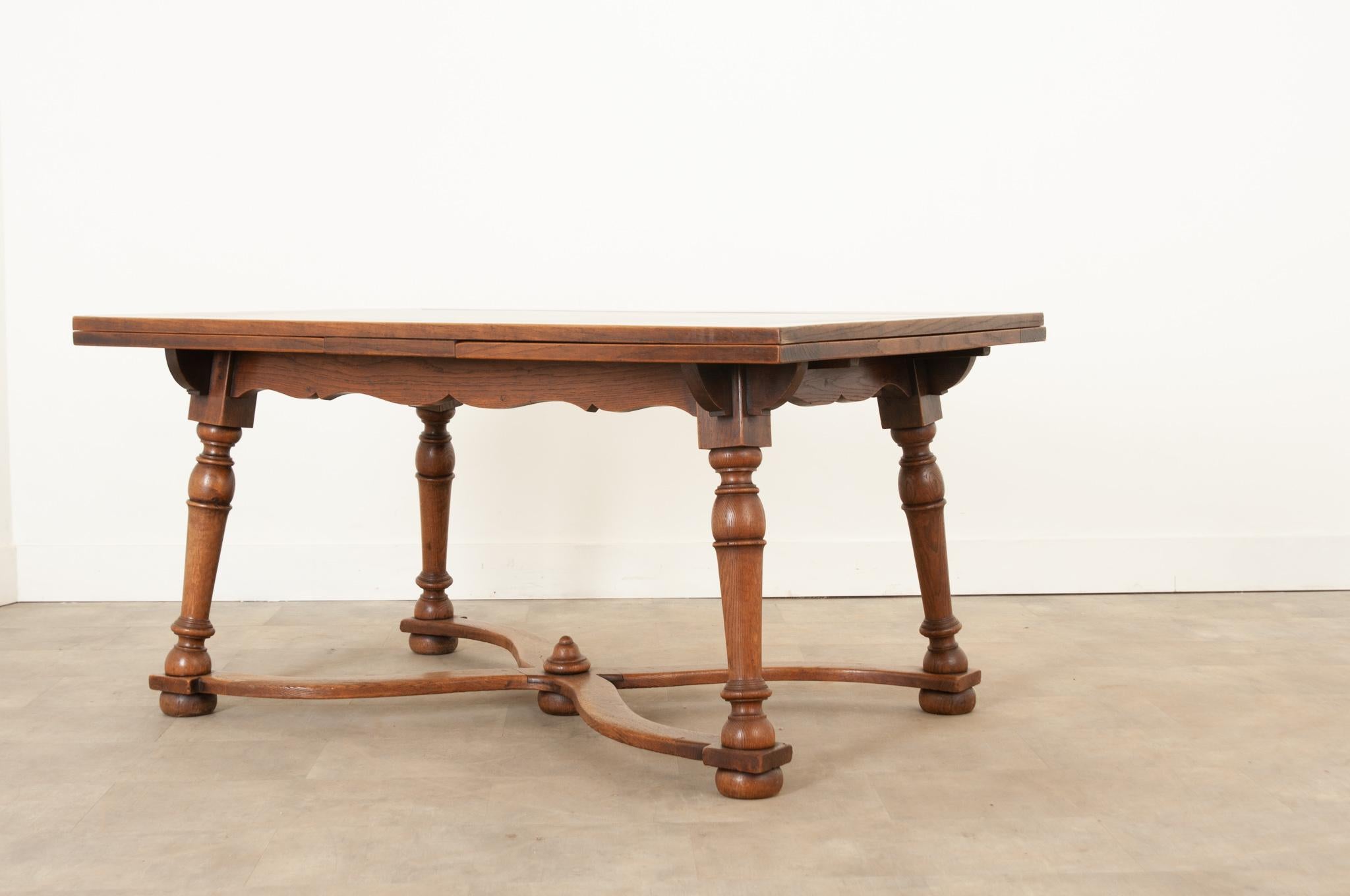 A wonderful Swiss draw leaf table crafted during the 1830s from solid oak with an inset slate top. The stone top is perfect for a hot tea kettle or pot as it will not be damaged, making this a great serving or dining table. Inset slate tops were a