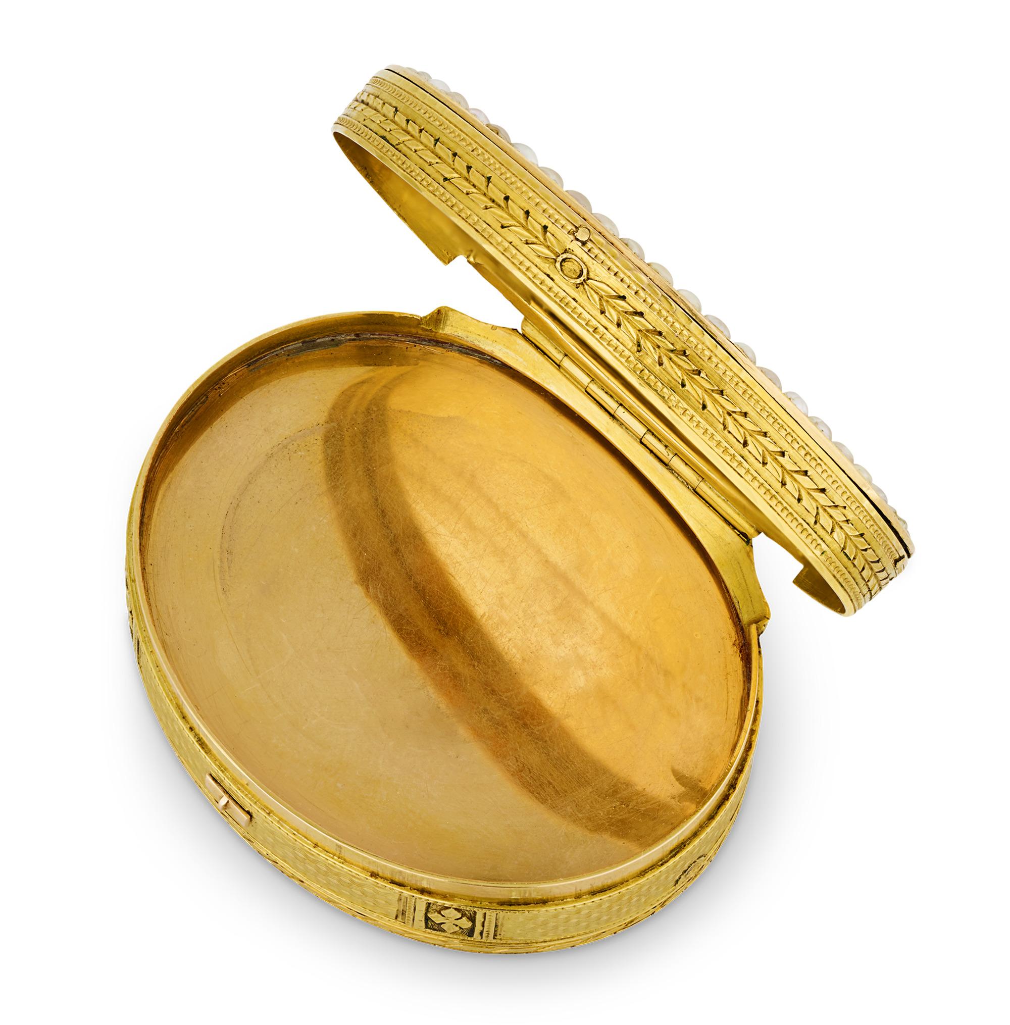 This exceptional 19th-century gold box appears at first glance be an exquisite snuff box adorned with a charming Swiss enamel vista encircled by a multitude of natural pearls. A quick wind of the key, however, reveals the complex mechanism hidden