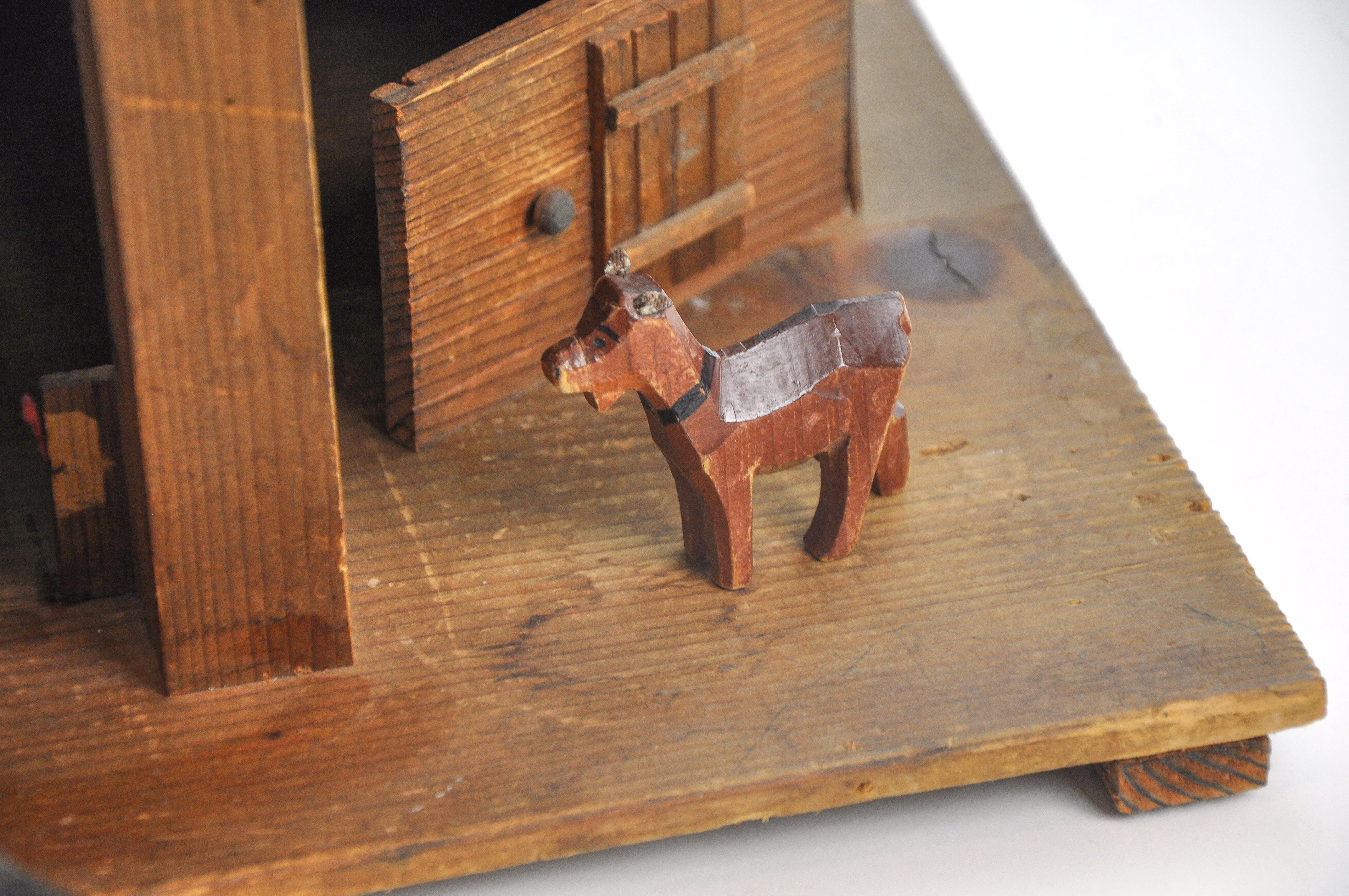 This wonderful hand carved old stabile made of solid wood from the Bernese Mountains with its 3 scale cows and a Goat from Trauffer, is not only suitable as a toy, but also as an unconventional decoration in the style of alpine Folk Art. A