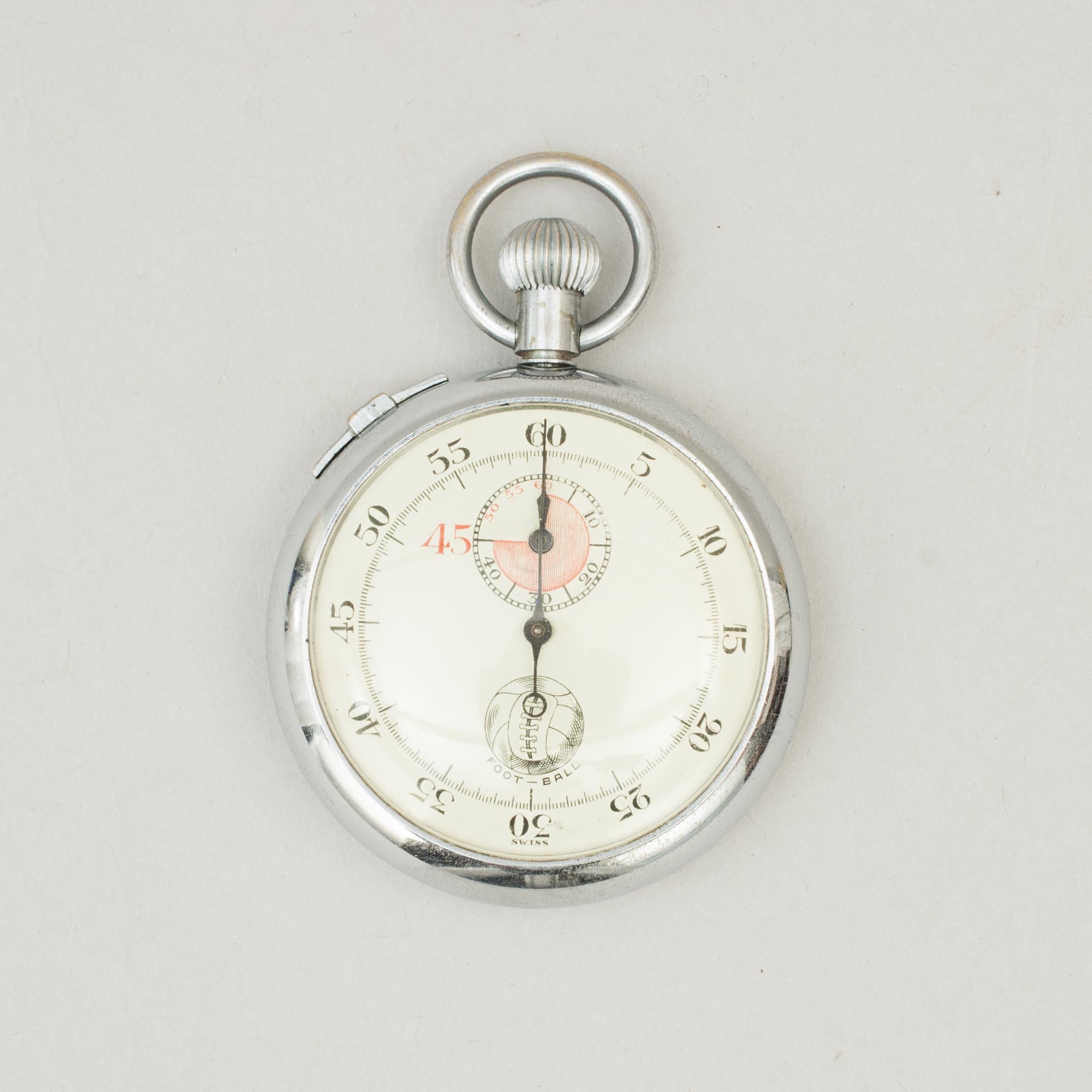 Referee's football stop watch.
A Swiss 45 minute referees foot - ball timer. The main dial divided into 60 seconds, the subdial into 45 minutes. There is an image of a laced football with the wording 'FOOT - BALL' also on the dial face. The stop