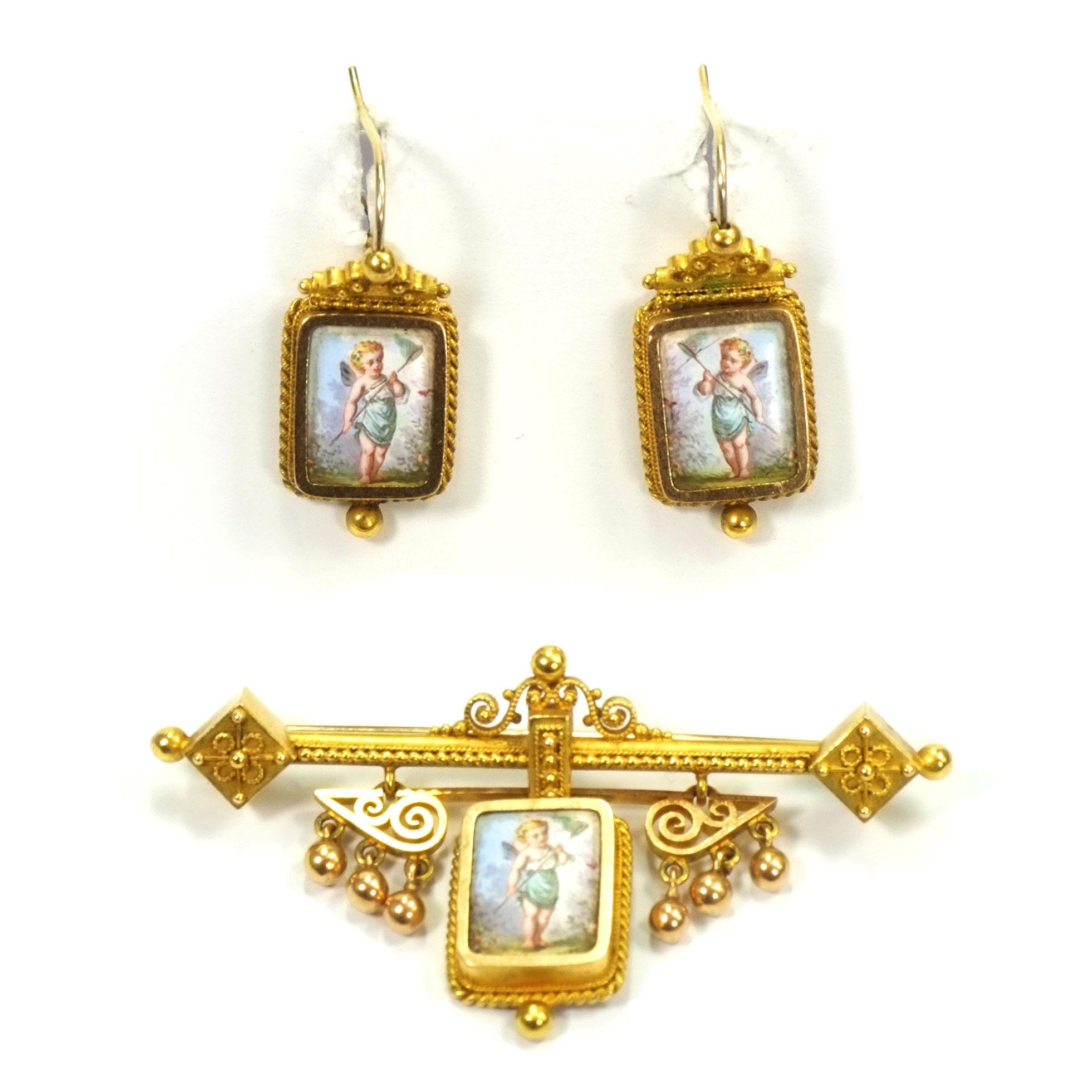 Swiss Gold Demi Parure Earrings and Brooch with miniature painting, circa 1870

Very decorative jewelry set in the Neo-Etruscan style with filigree gold wire soldering and granulations, elaborately worked and each set with a porcelain plaque. A
