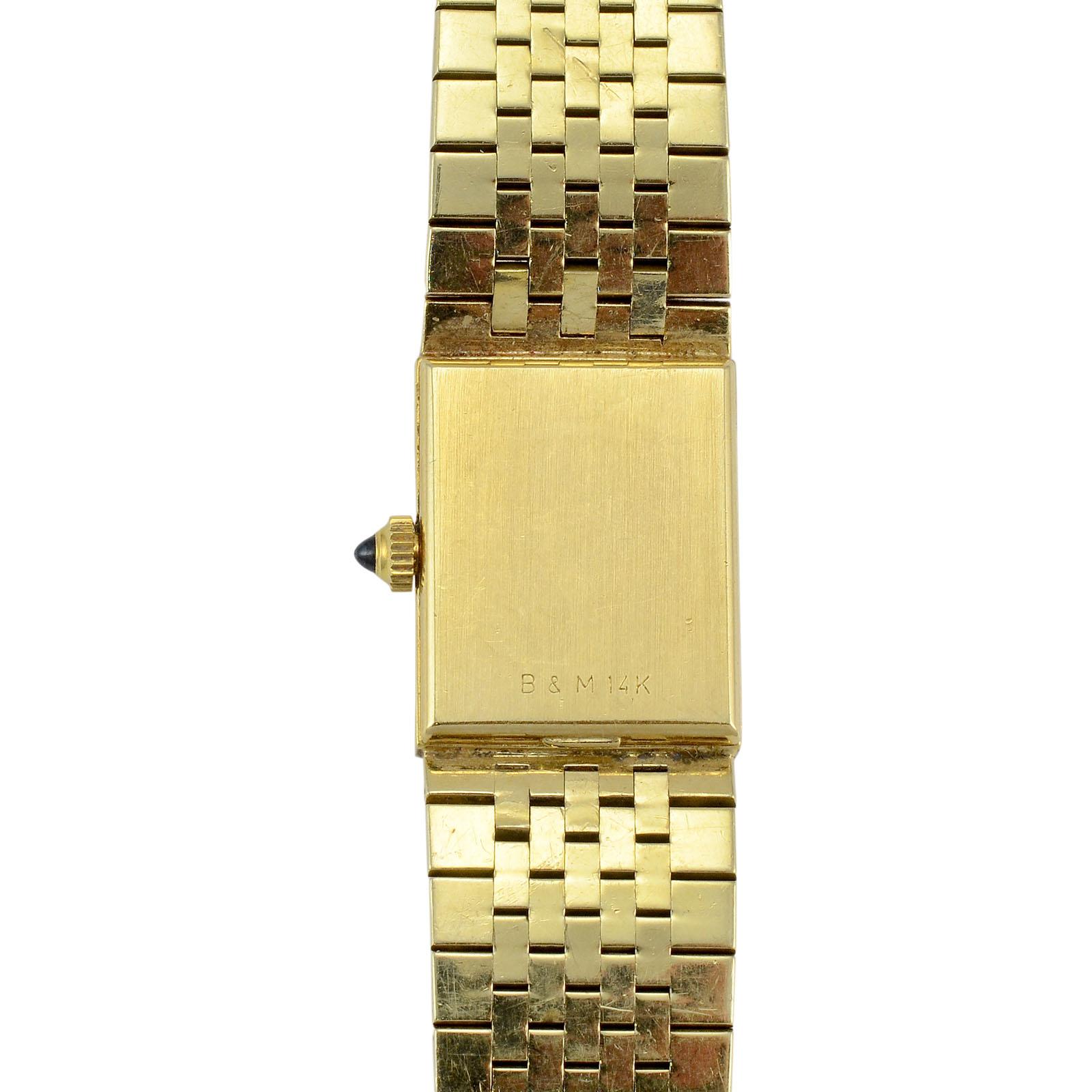 Estate Swiss ladies wrist watch by Baume and Mercier. This 14 karat yellow gold wrist watch by Baume et Mercier features a quartz movement, and bracelet with 12 diamonds at 0.22 carat total weight. The diamonds have VVS-VS clarity and F-G color.