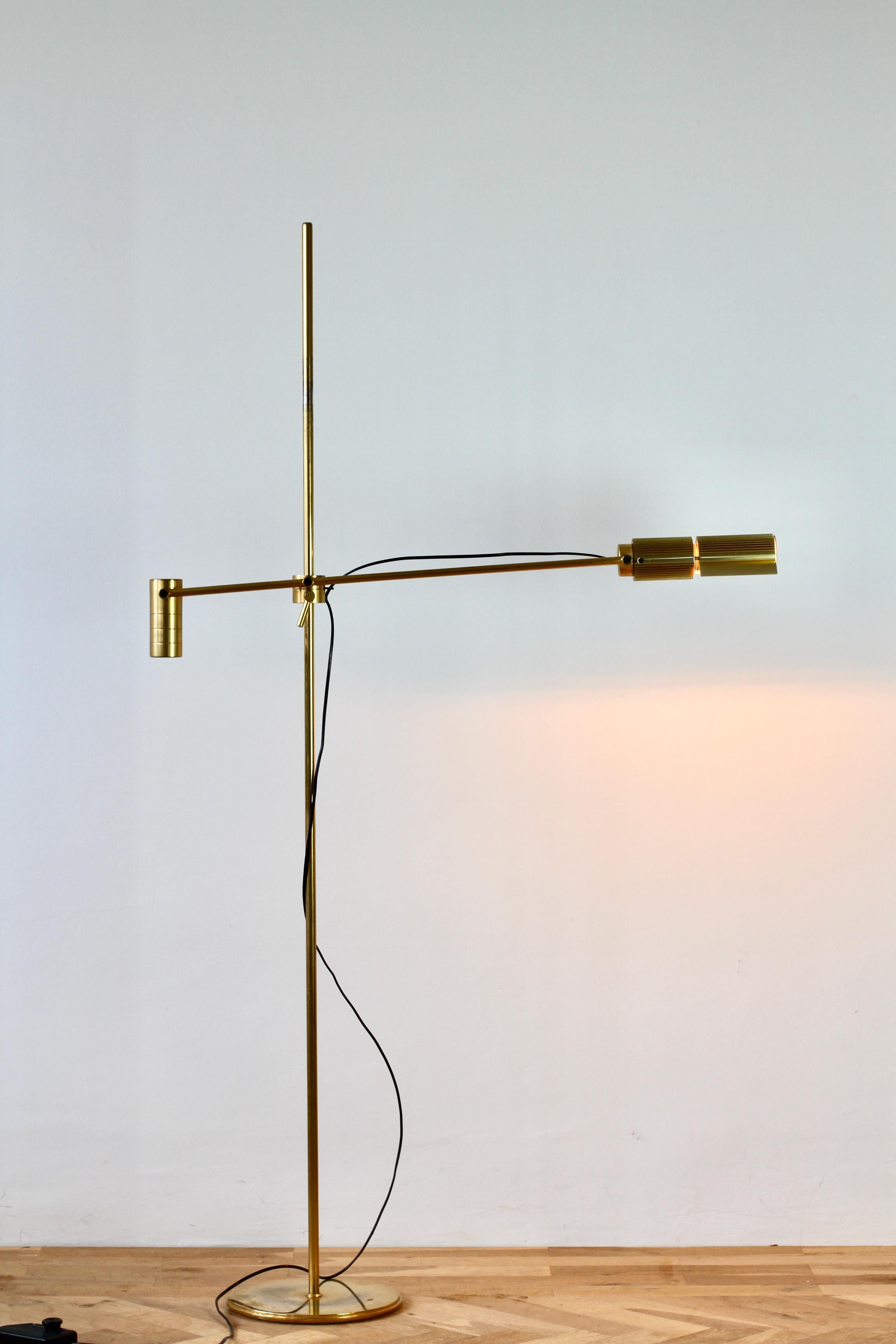 Rare Mid-Century Modern vintage European, Swiss made dimmable 'Haloprofil' floor lamp designed by Viktor Frauenknecht for Swiss Lamps International circa 1970s - early 1980s. Featuring gold plated brass (now with age related patina) and fully height