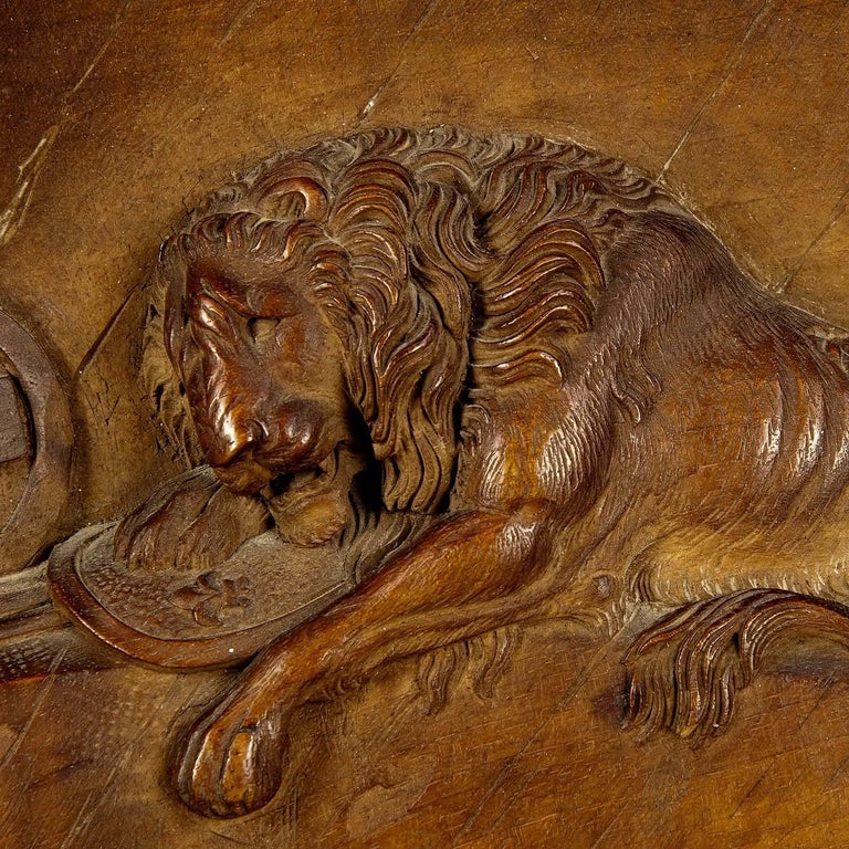 Fine lion wood carving relief depicting the Swiss deadly wounded lion of Luzerne. The original statue reminds of the deadly wounded Swiss guardsmen of 1792. Brienz, circa 1900

Measure: width 13.39