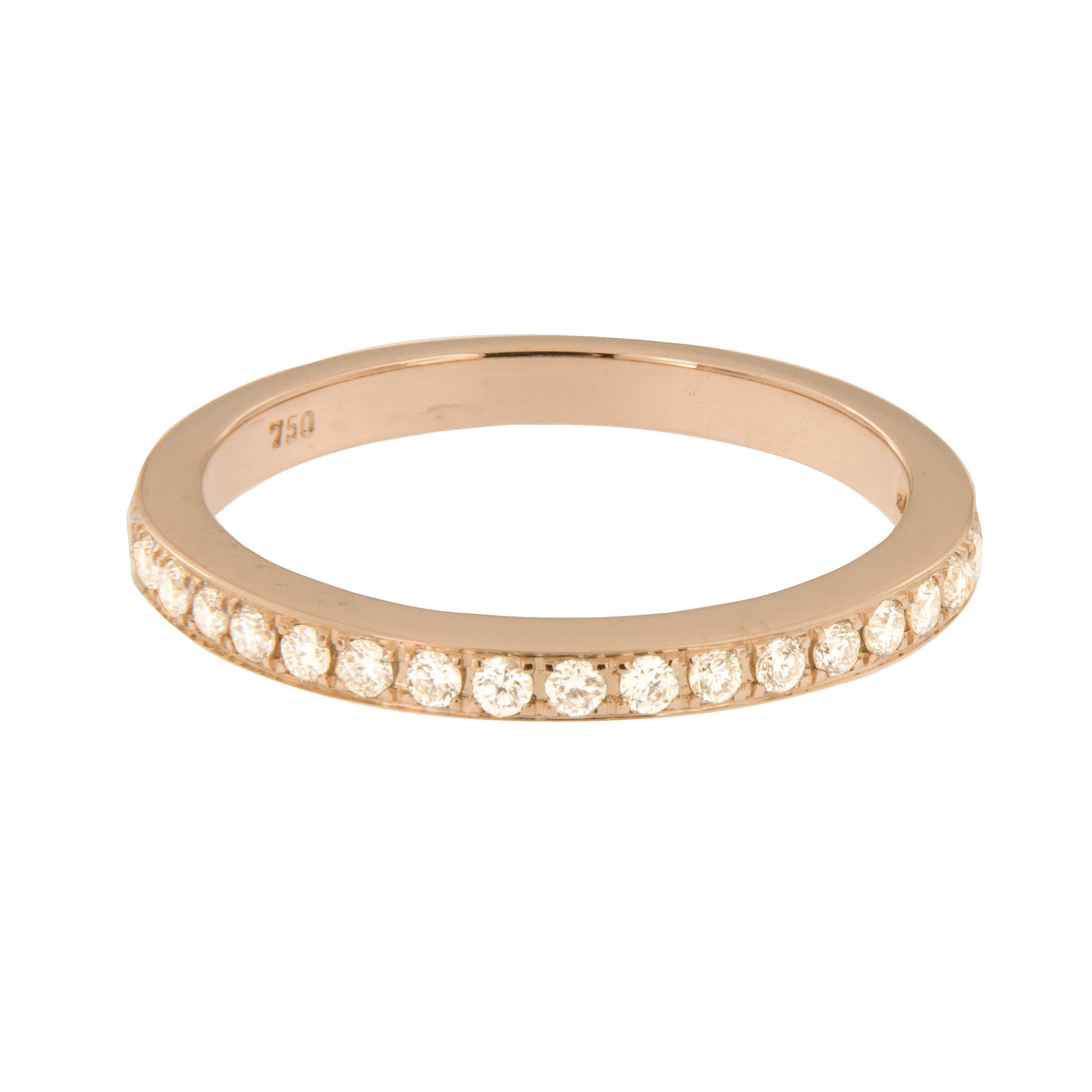 Beautiful white diamonds accent the top of this Swiss Made 18 karat rose gold band that can be worn alone or also looks fantastic stacked! This timeless ring can be cherished & passed down with 21 round brilliant cut diamonds = 0.19 Cttw. Size